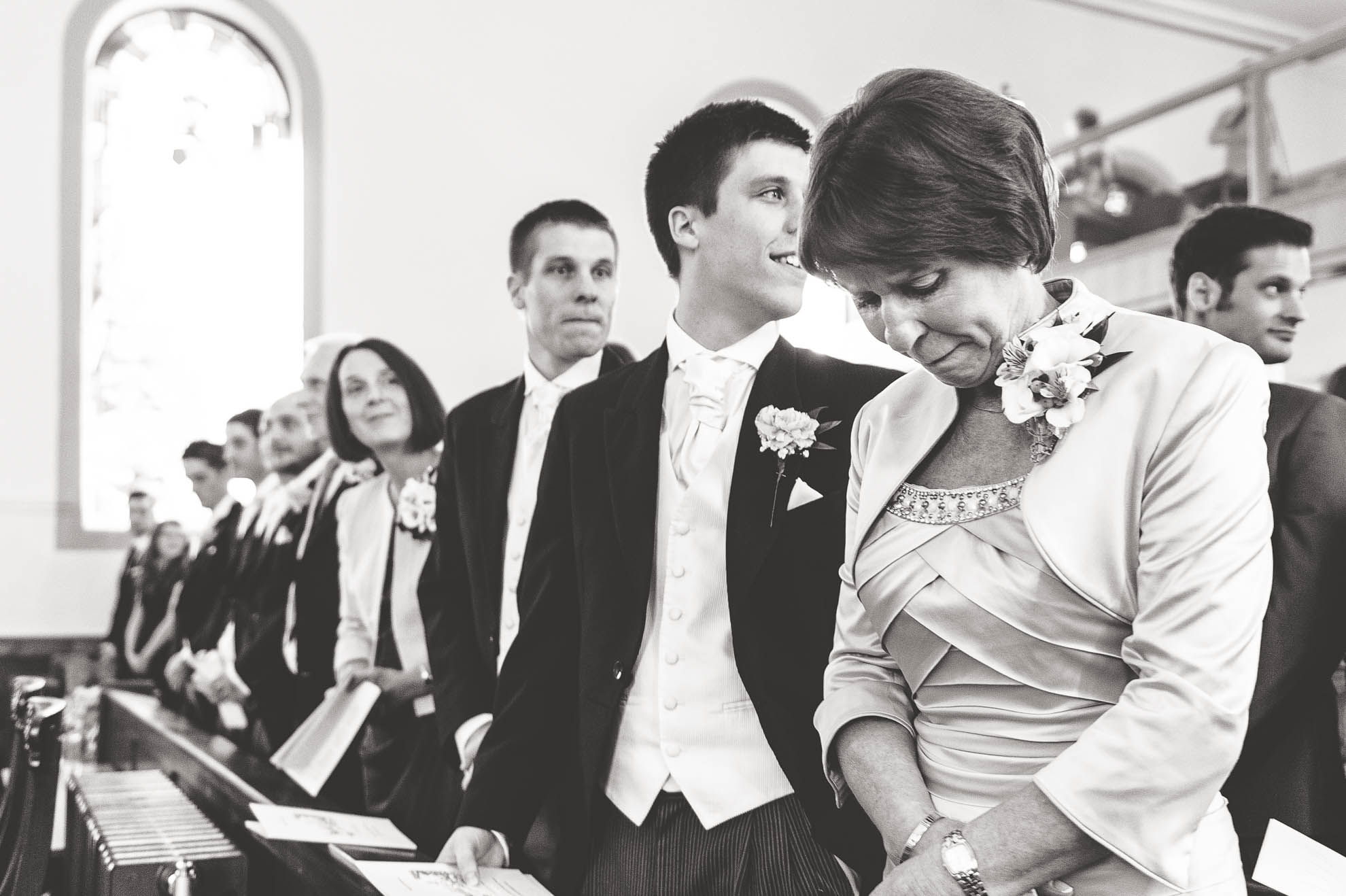 Mother of the bride becomes emotional as the bride walks up aisle