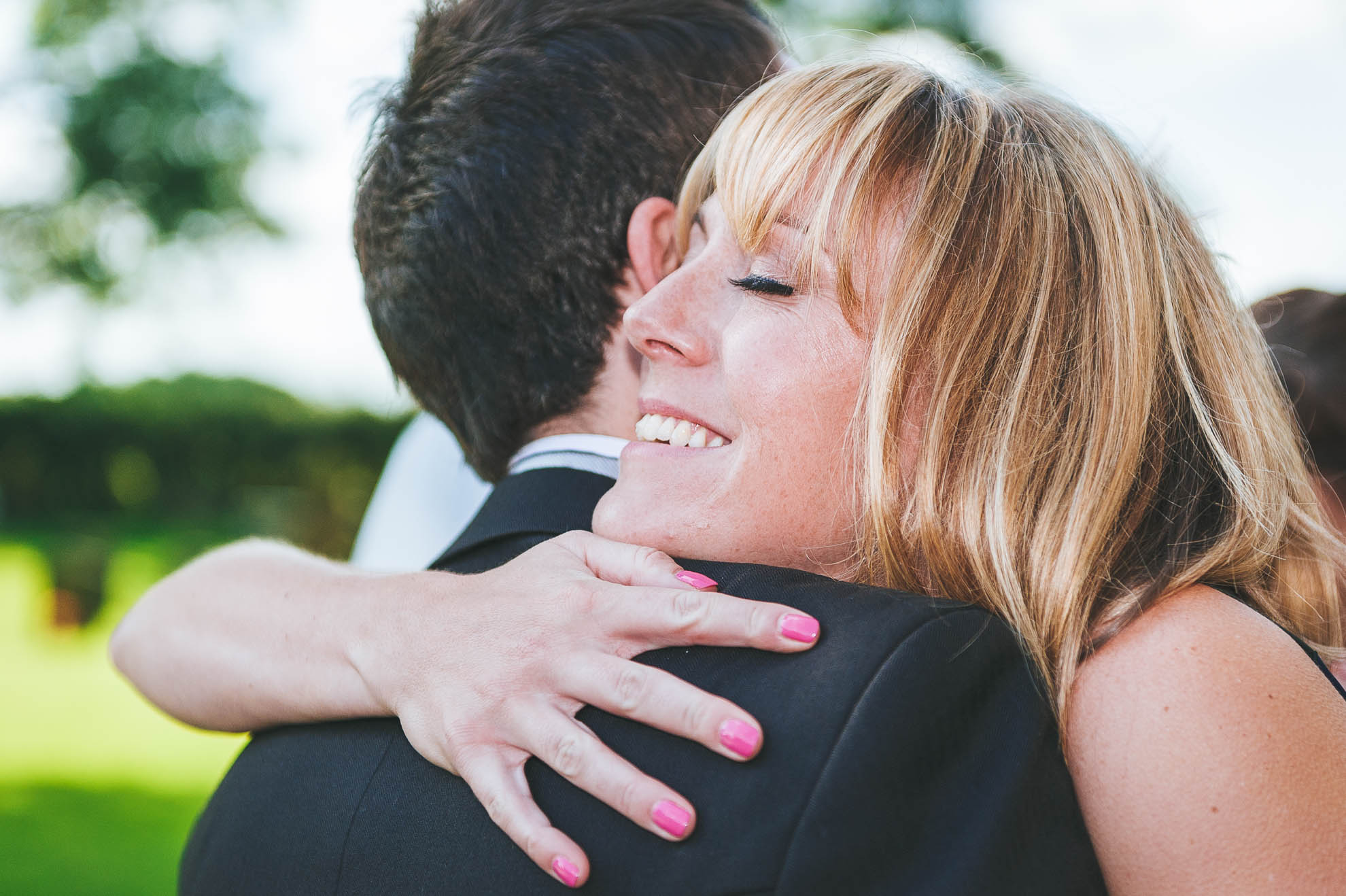Guest hugs the groom