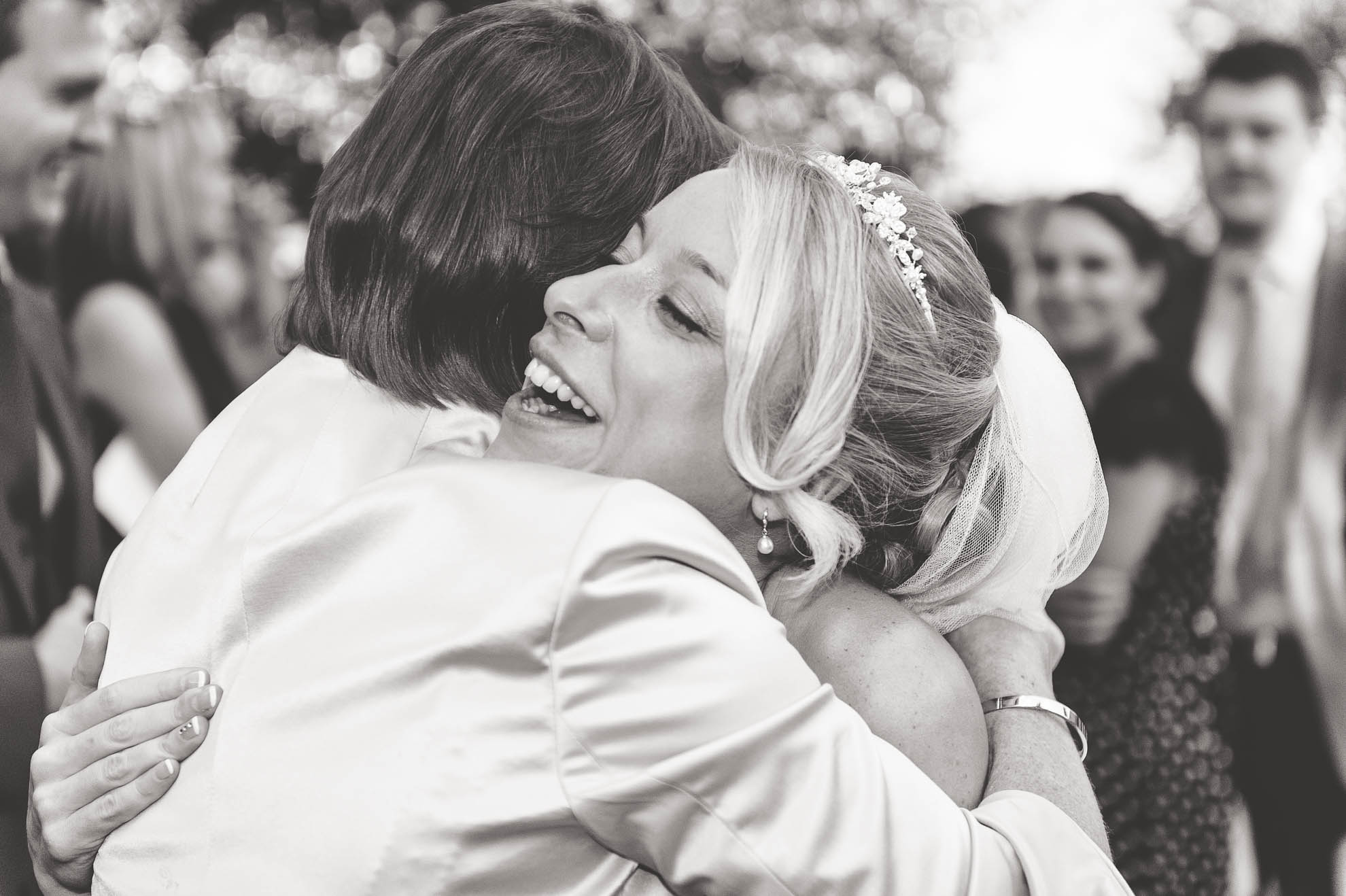 Bride and her mum hug