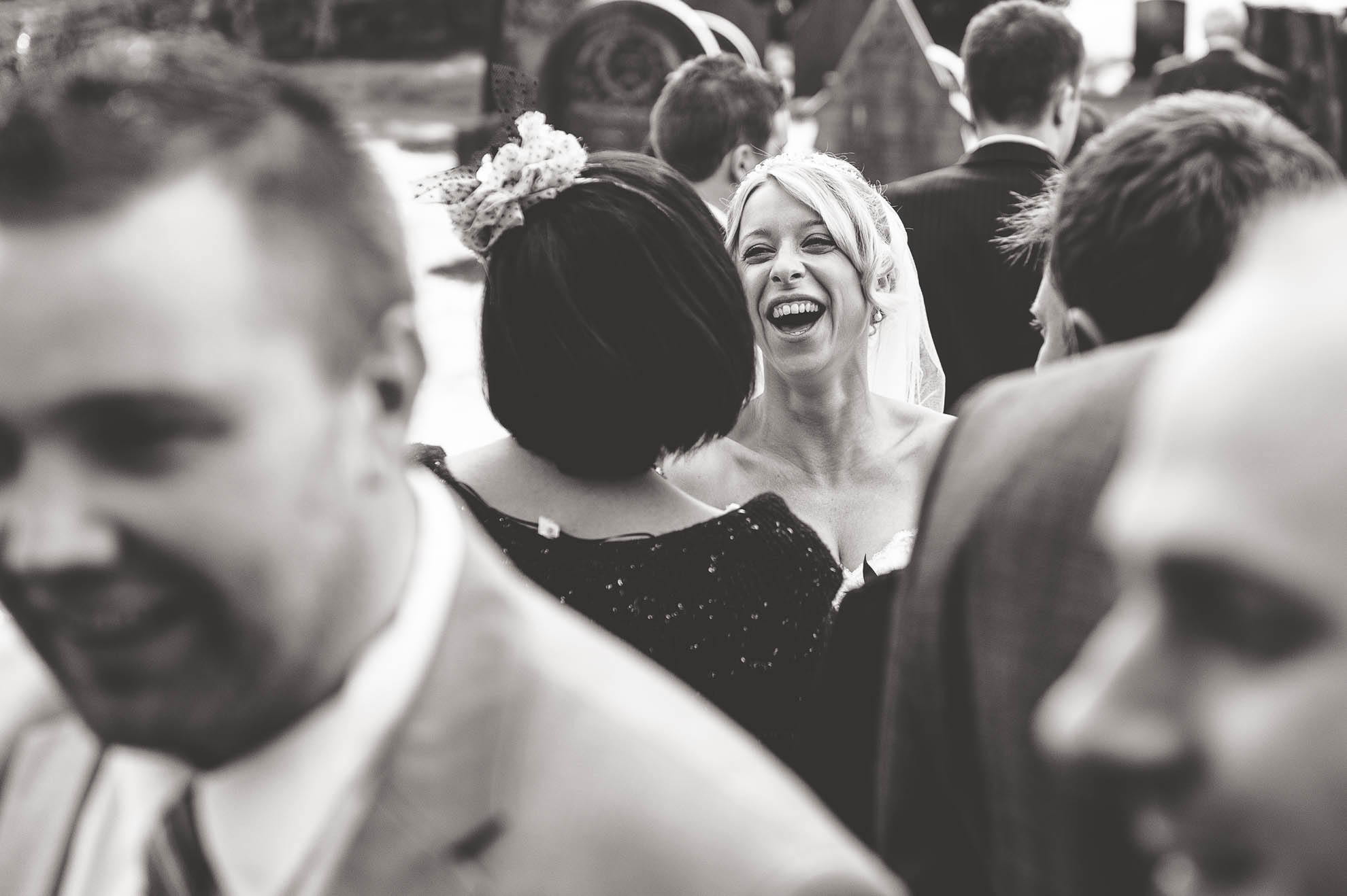 Bride shares a joke with a guest