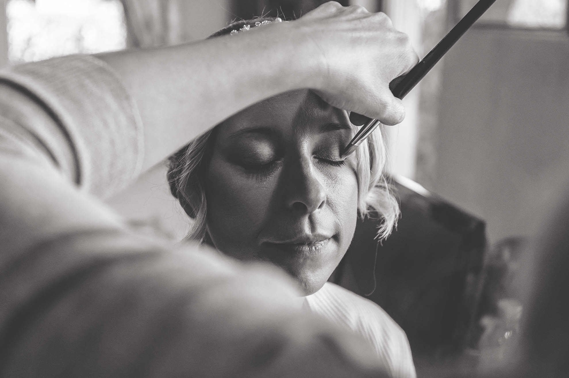 Bride having make up applied