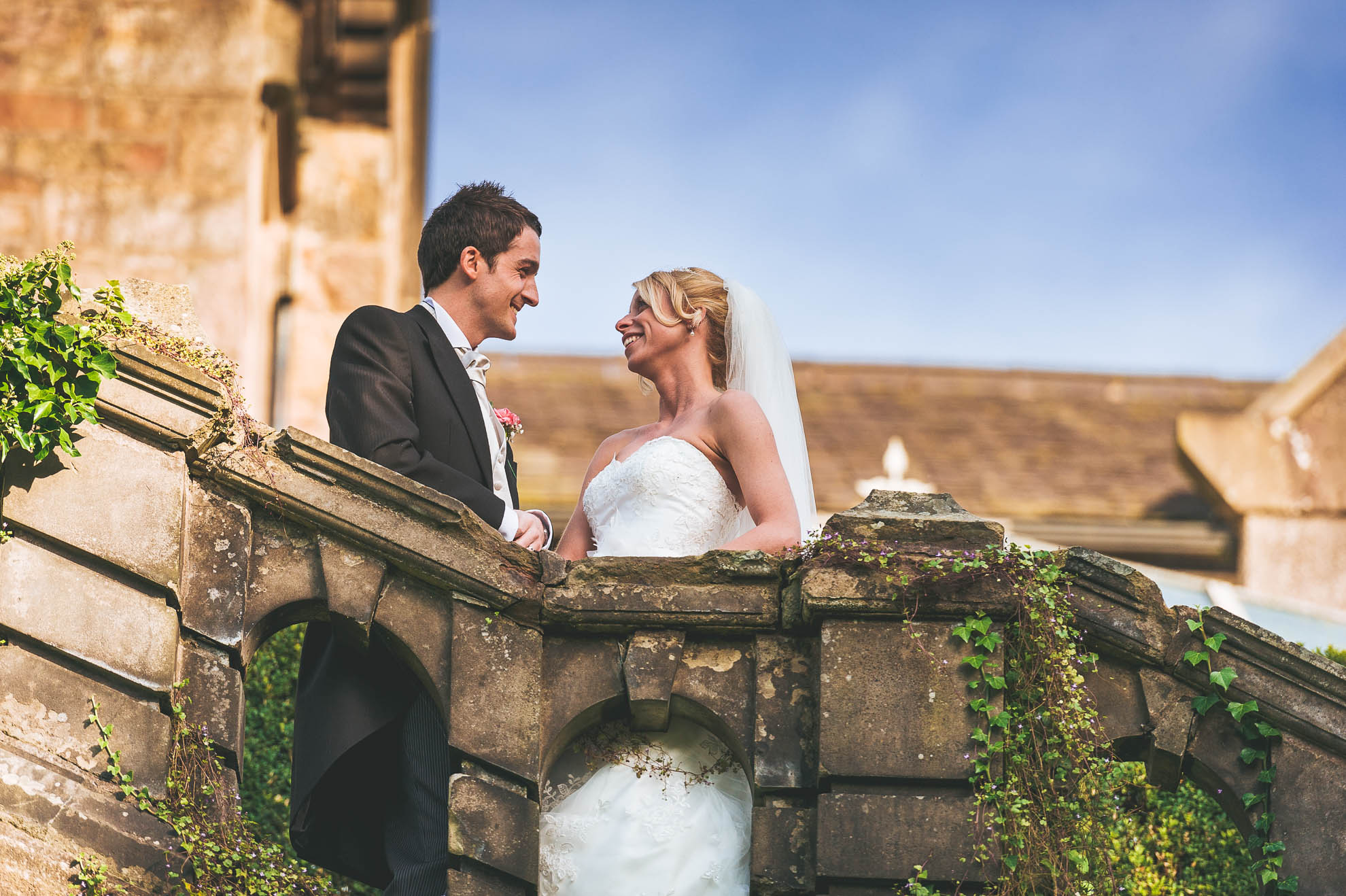 Portrait of bride and groom on steps