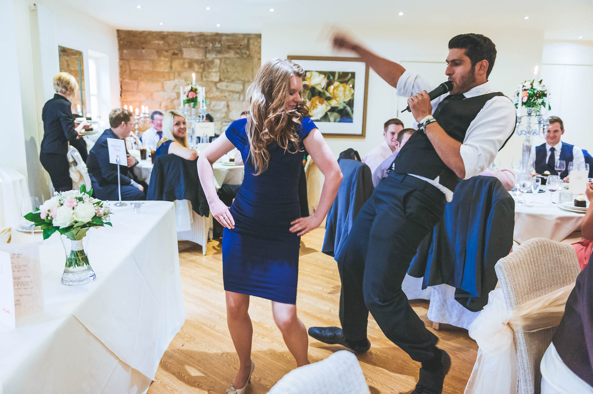 Guest dances with singing waiter