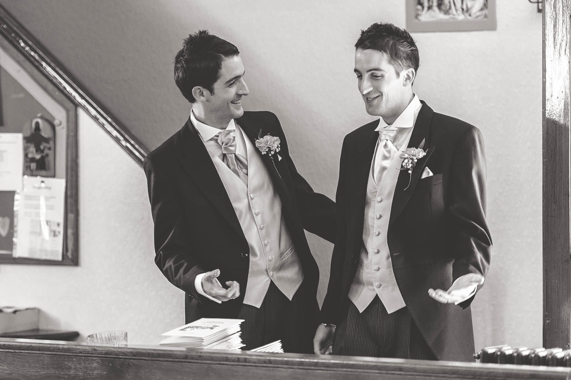 Groom and best man share a joke