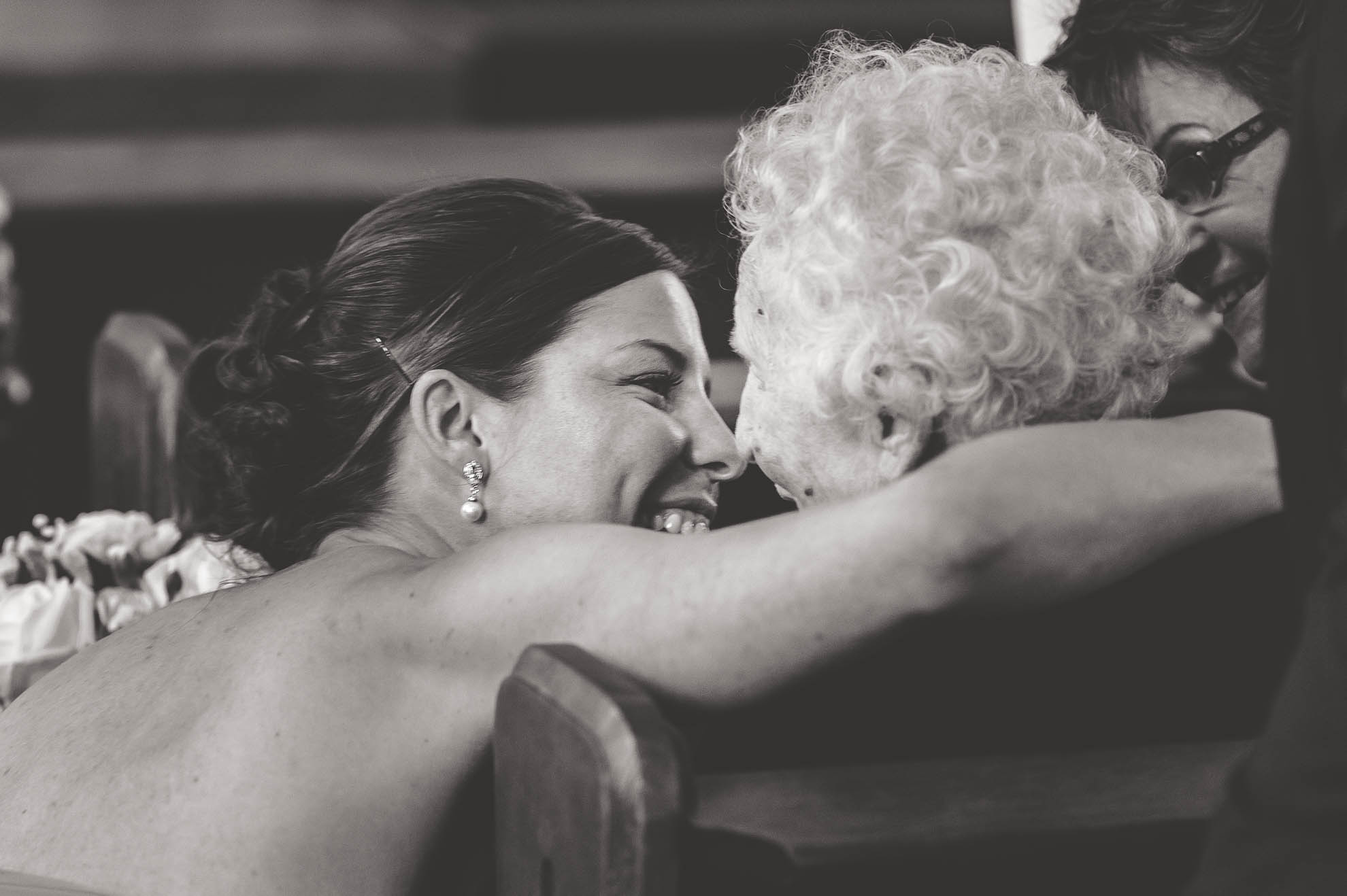 bridesmaid hugs grandmother