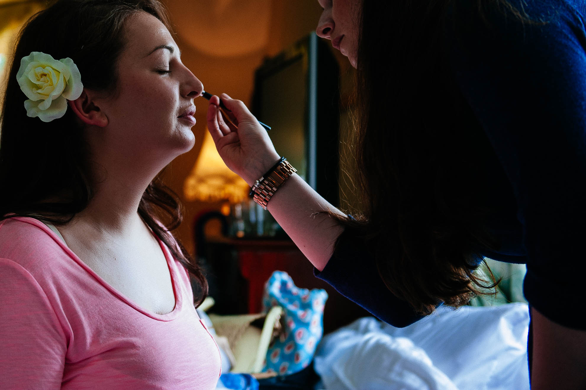 Bridesmaid having make up applied