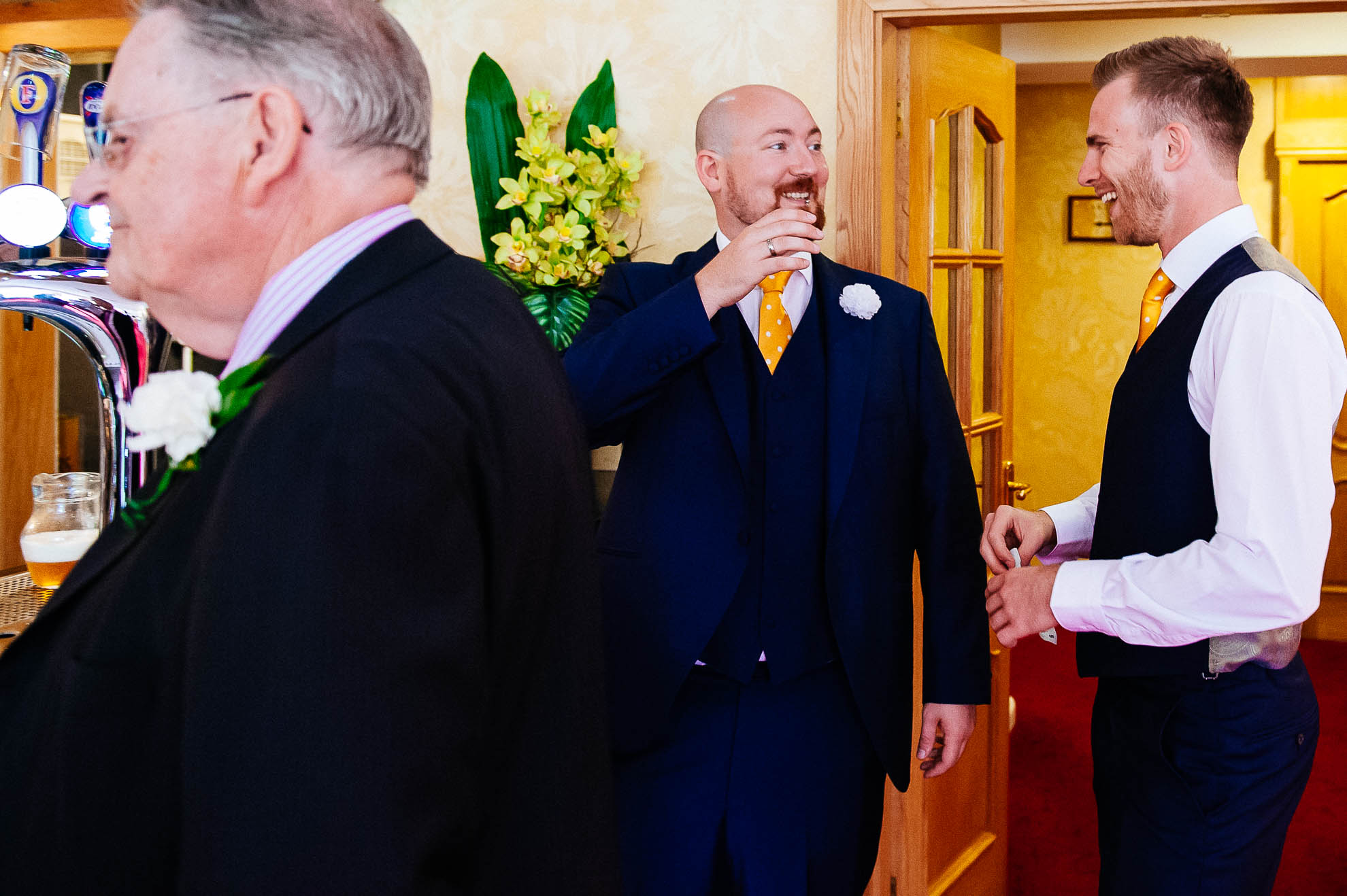 Best man and usher share a joke