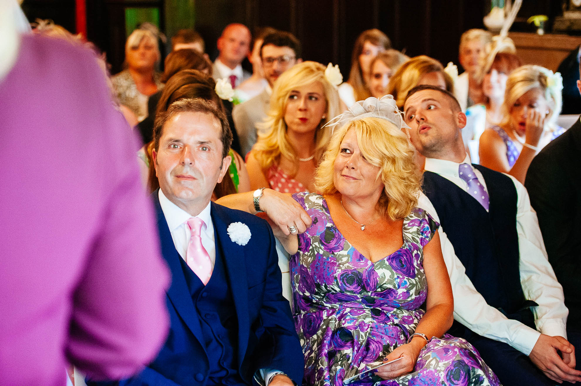 Mother of the bride looks on during the vows