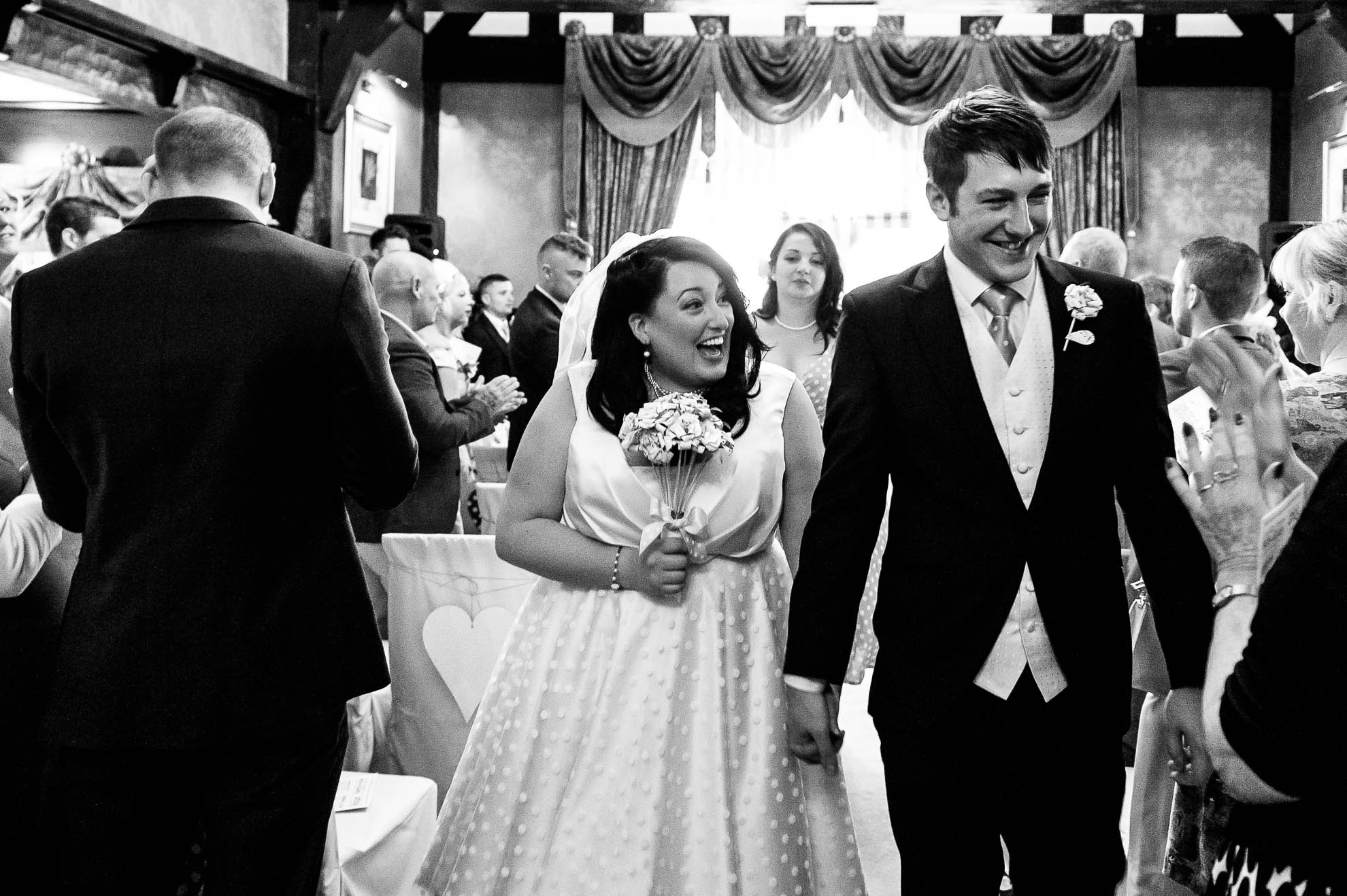 Bride and groom walk back down the aisle
