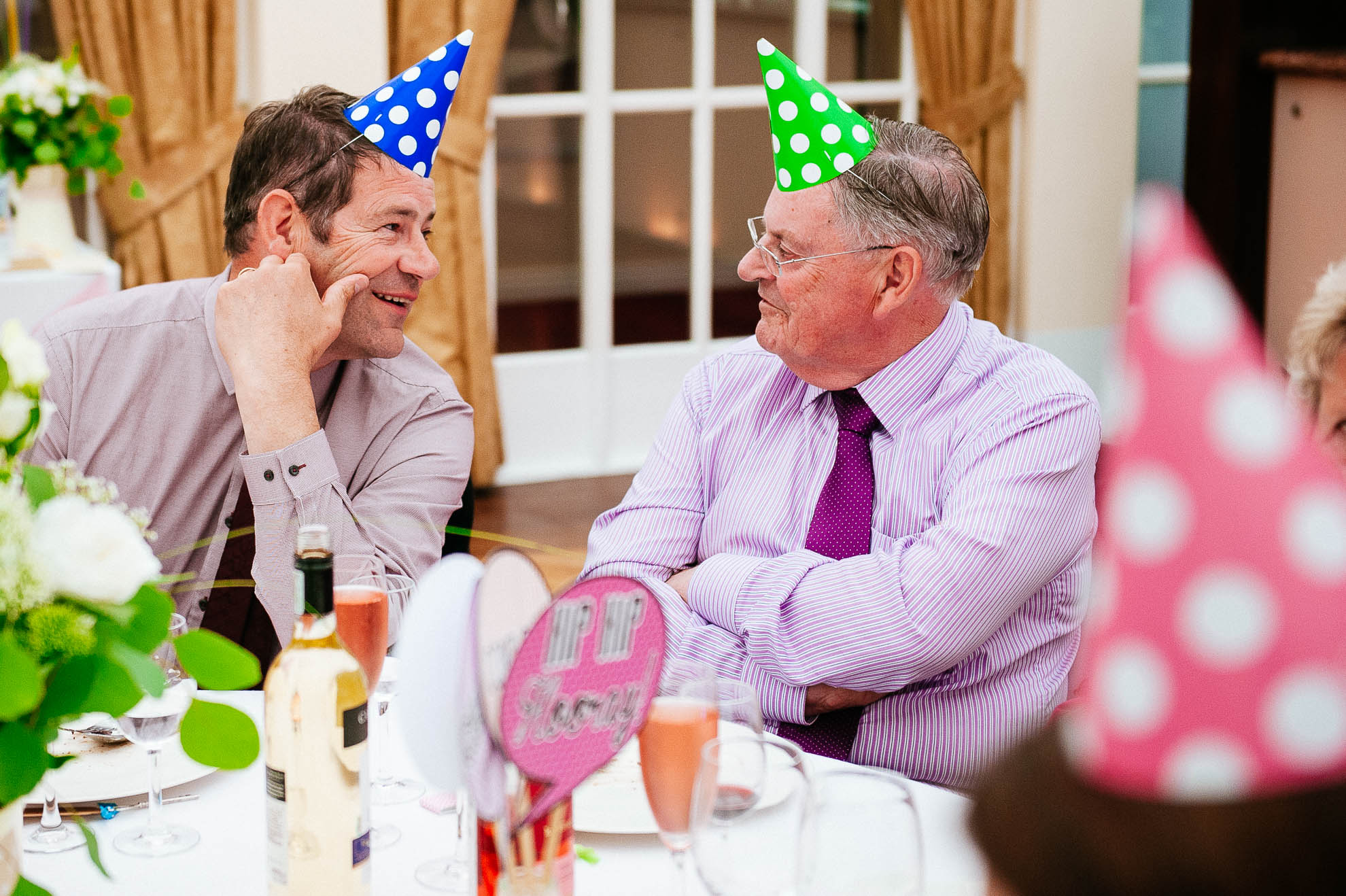 wedding guests with party hats