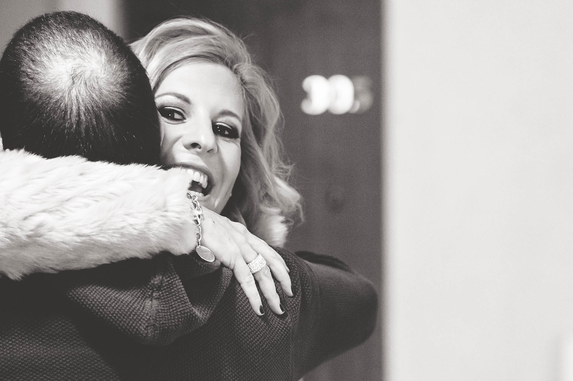 Guest hugs groom