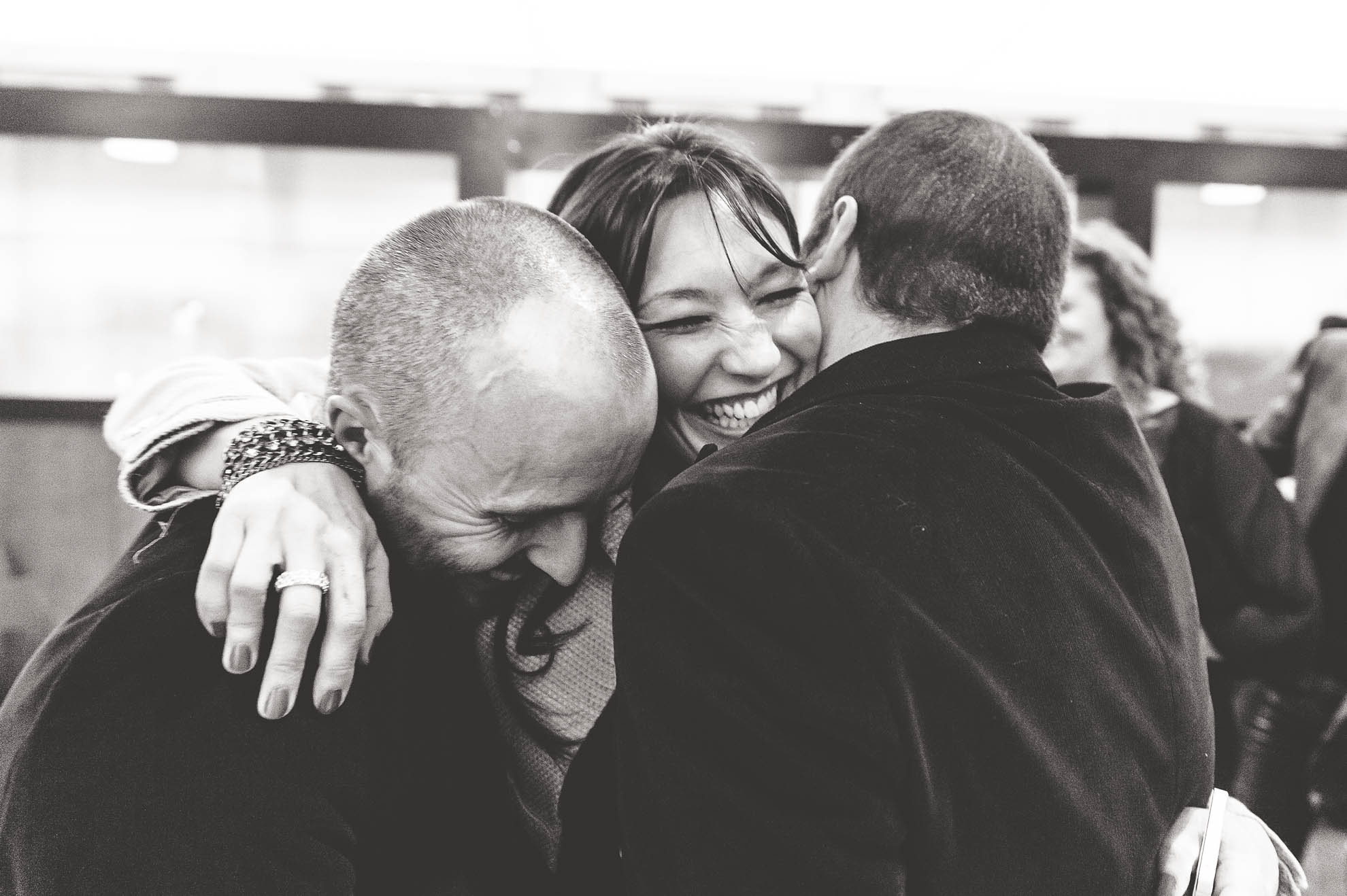 Guest hugs partners