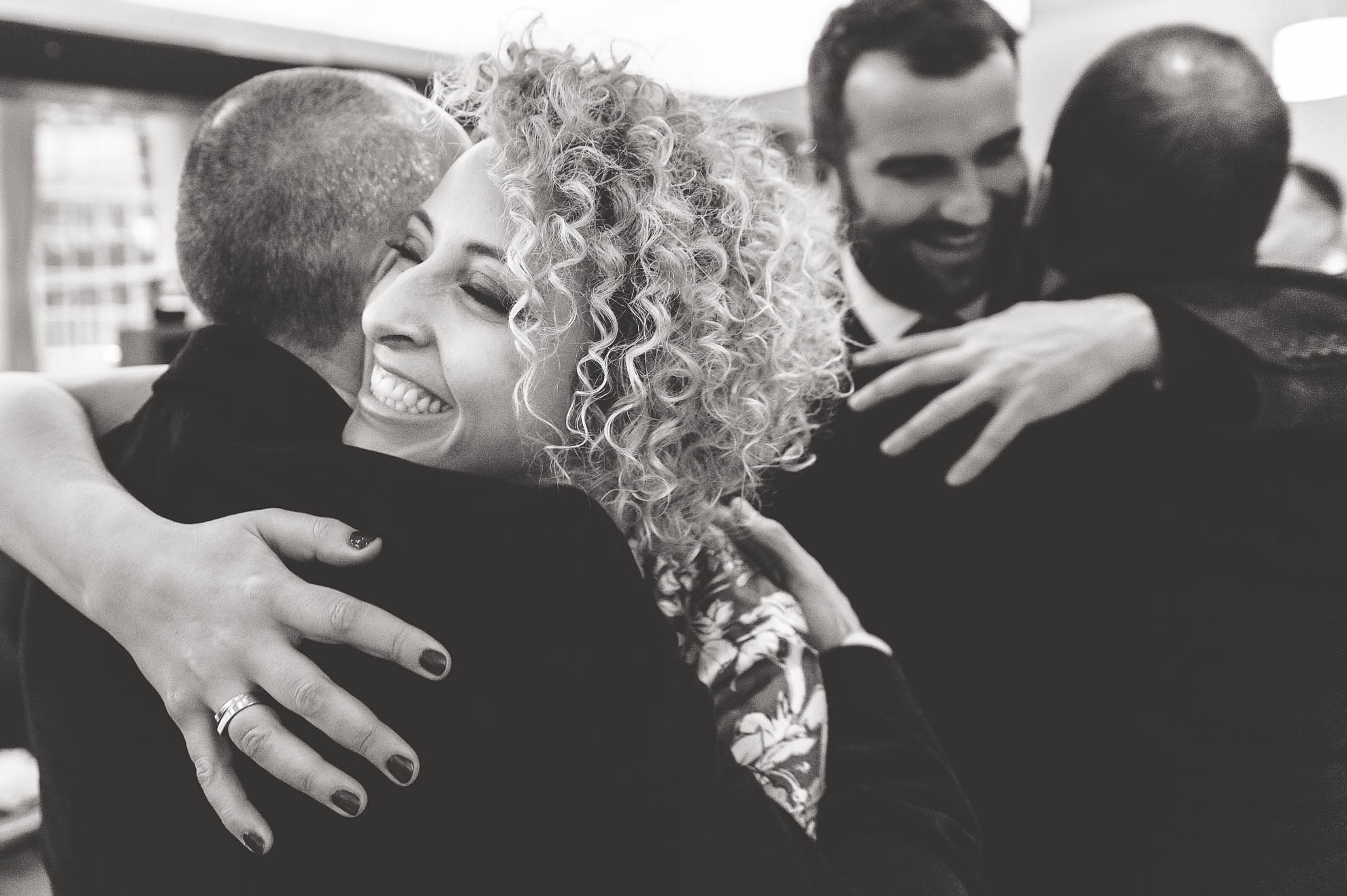 guest hugs partner