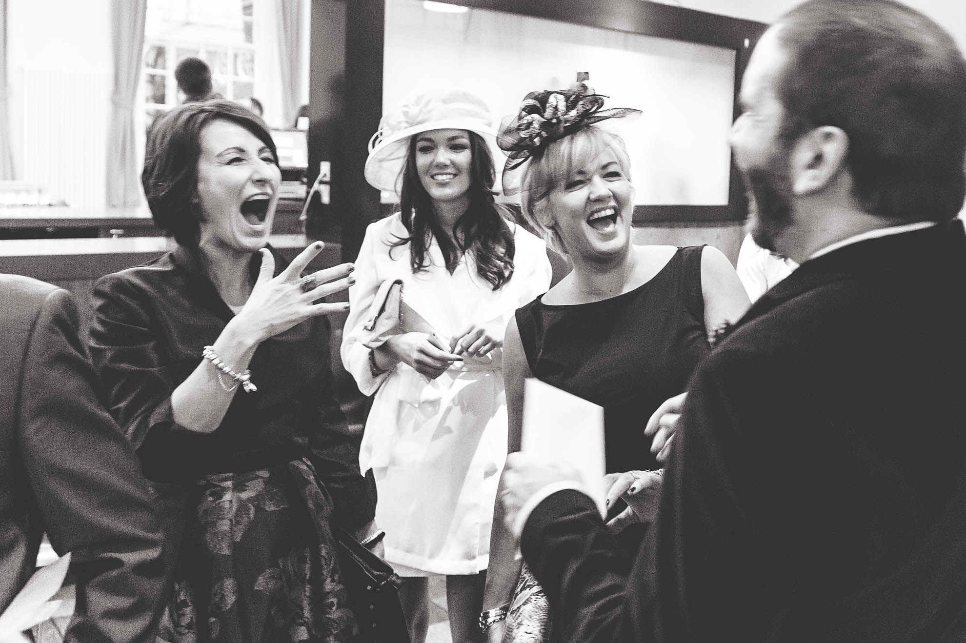 guests share a joke with partner