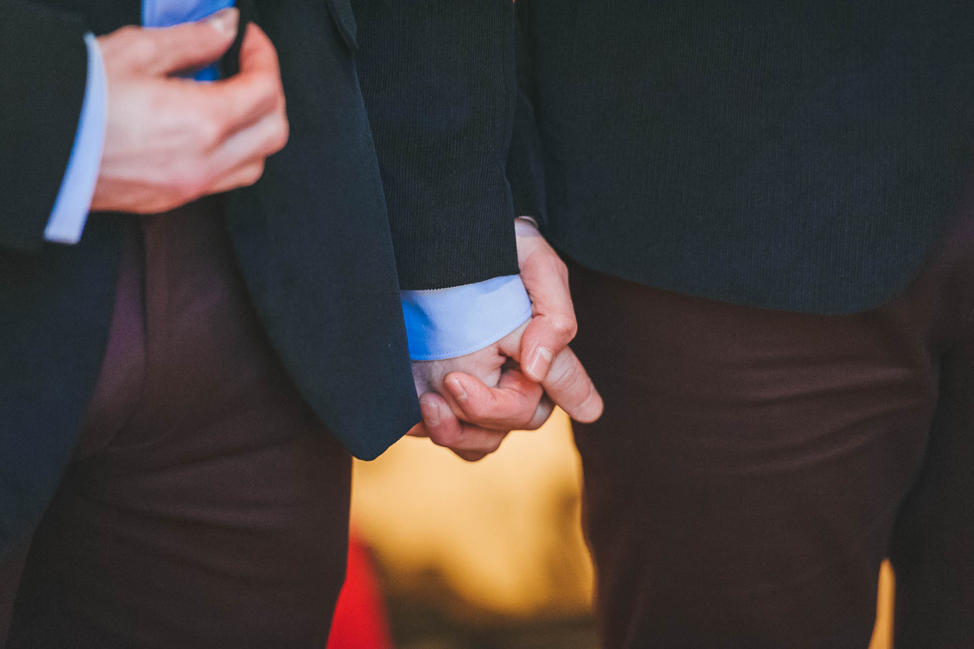 Partners hold hands