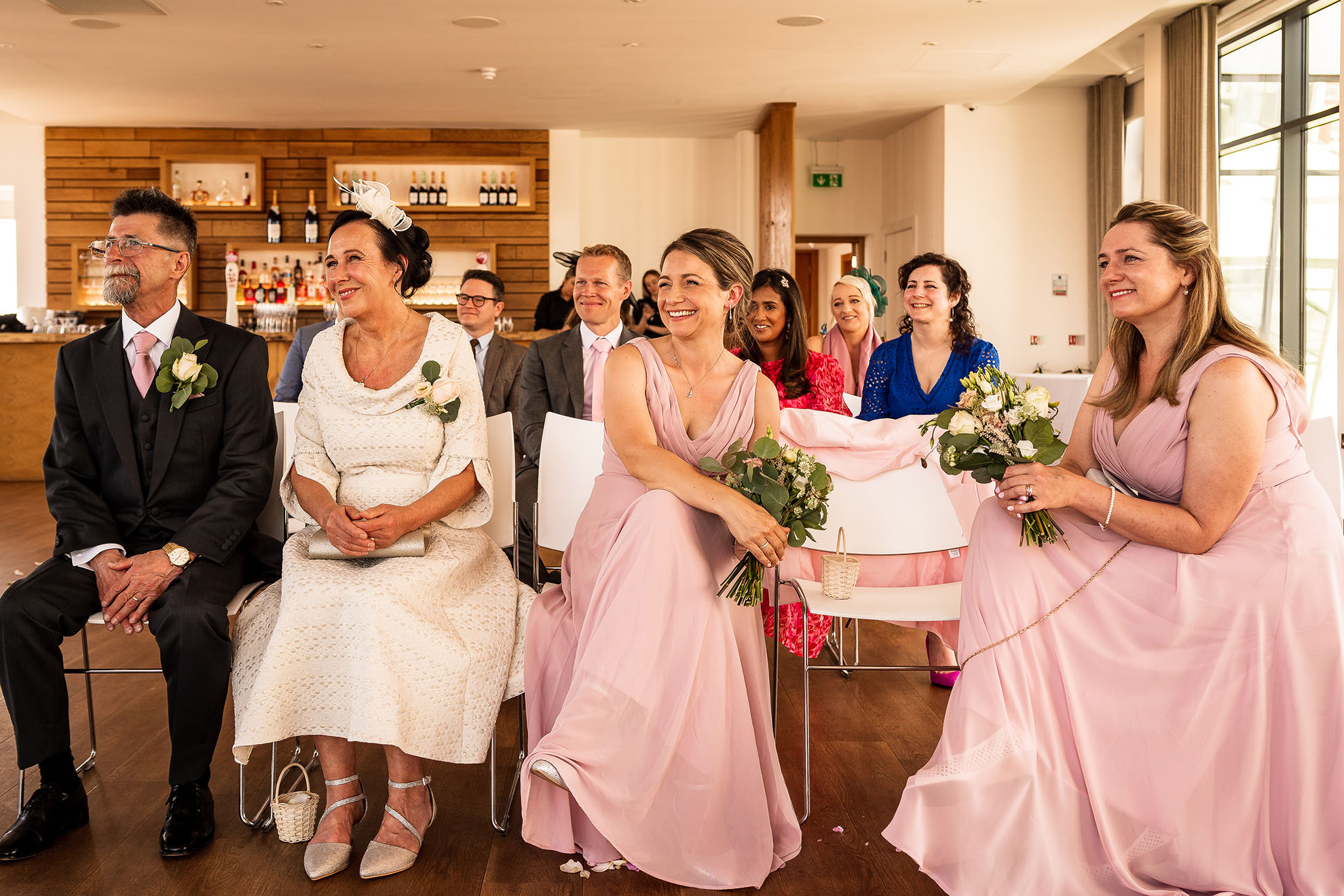 Brides family watch the wedding ceremony