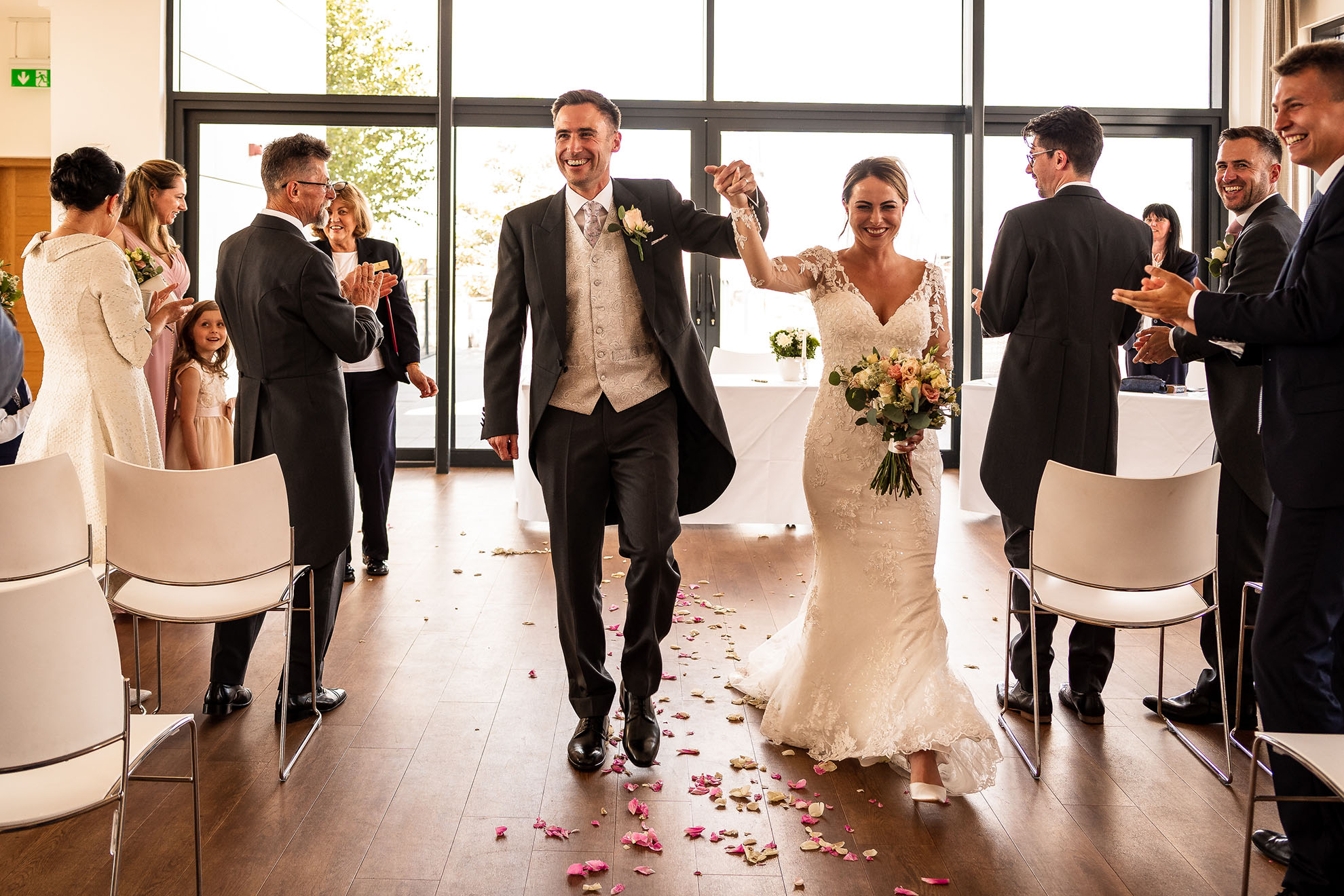 Bride and groom walk back down the aisle 