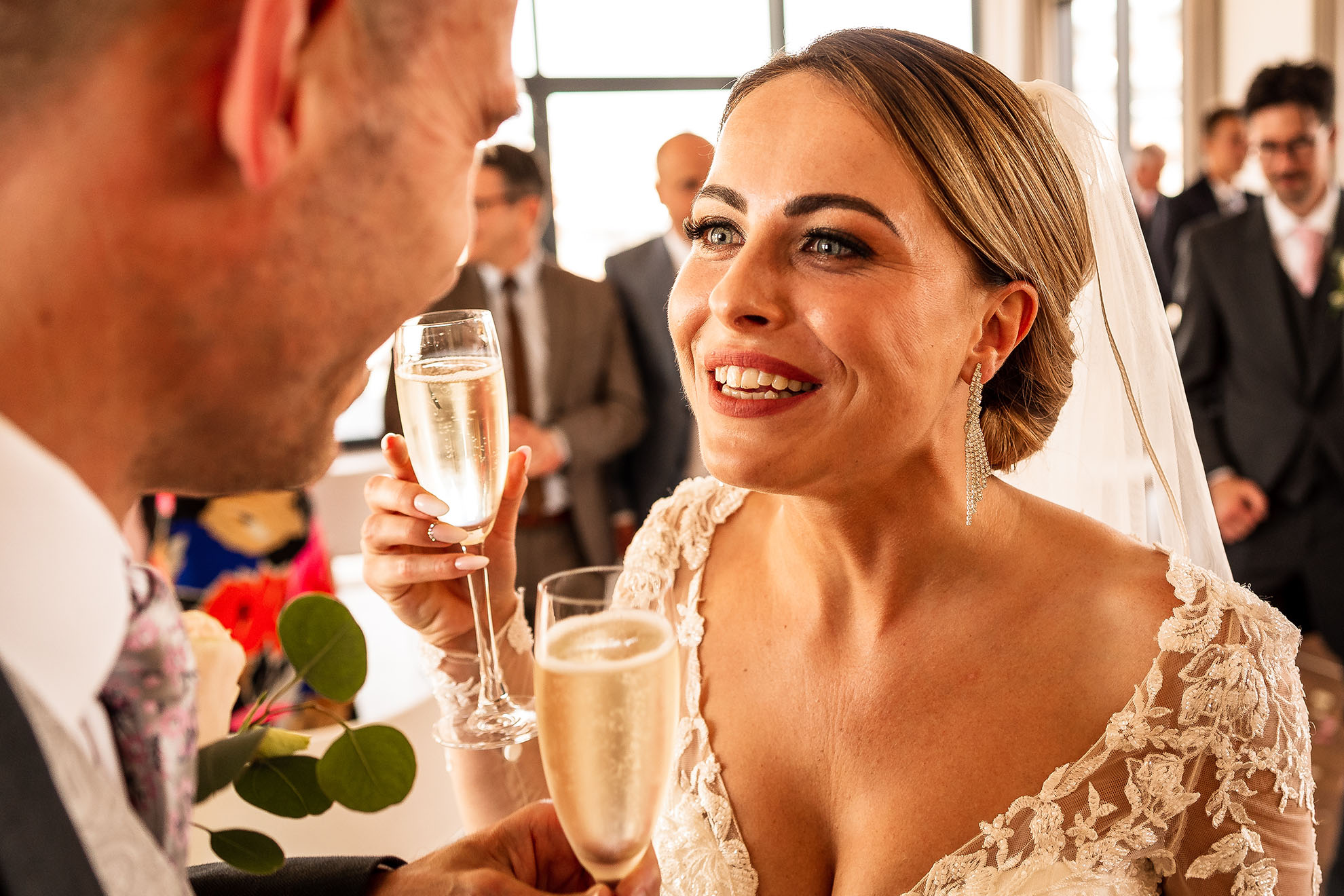 Bride and groom share a joke during drinks ceremony