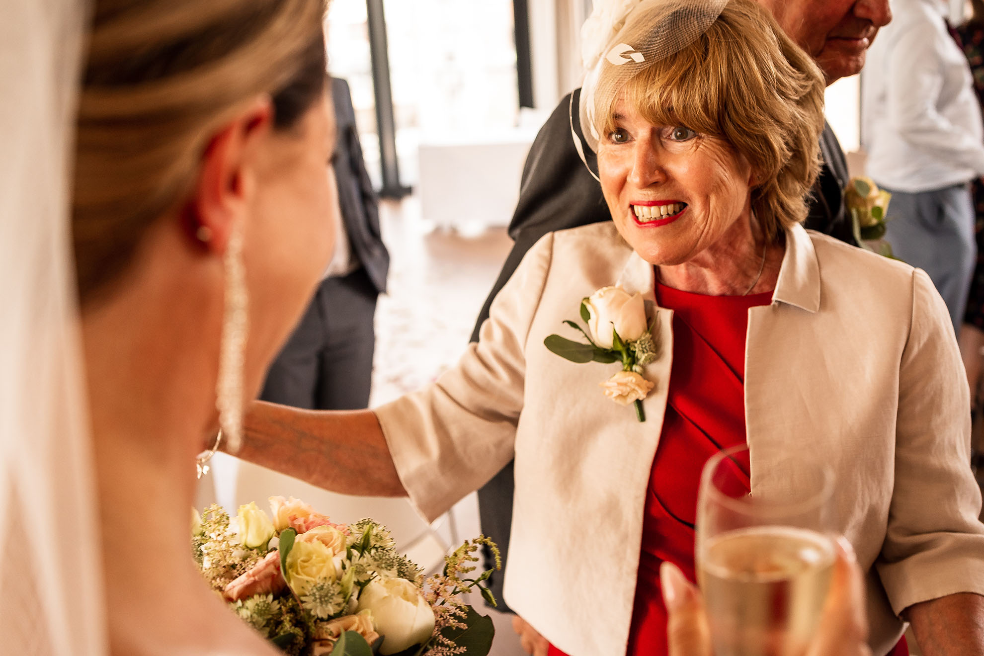 Mother of the groom congratulates bride