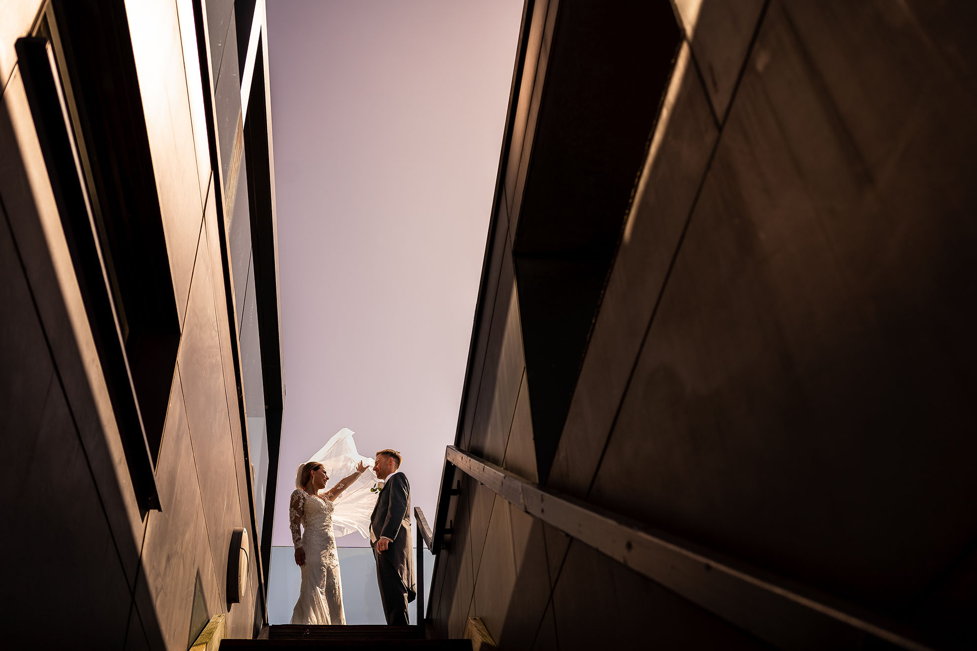 Bride and groom at top of hope street hotel stairs