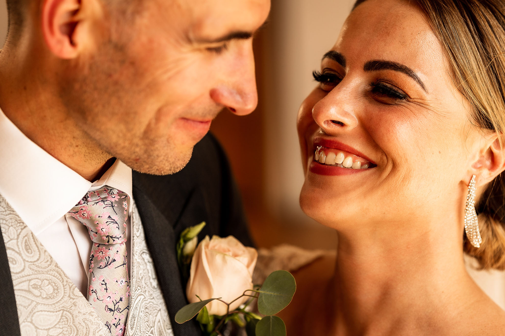 Bride and groom share a joke during the portrait shoot