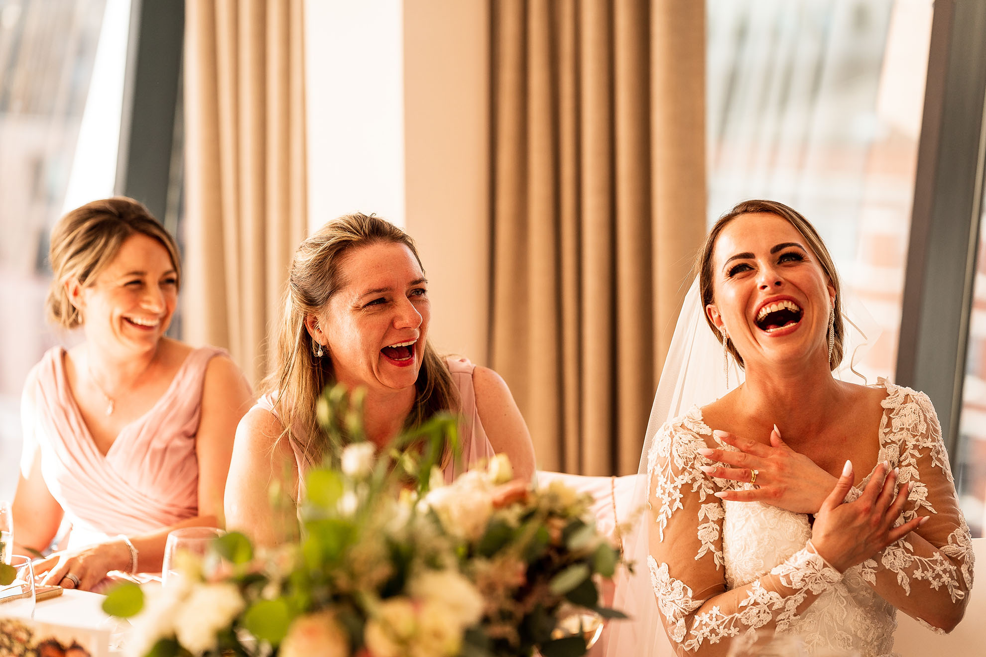 Bride and bridemaids enjoying speeches
