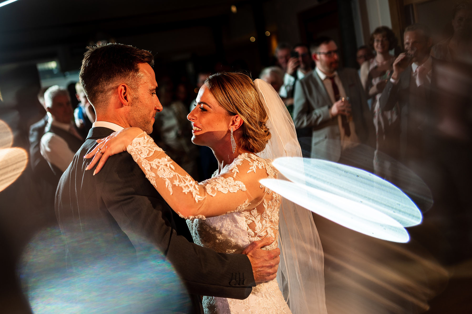 Bride and groom smile during the first dance