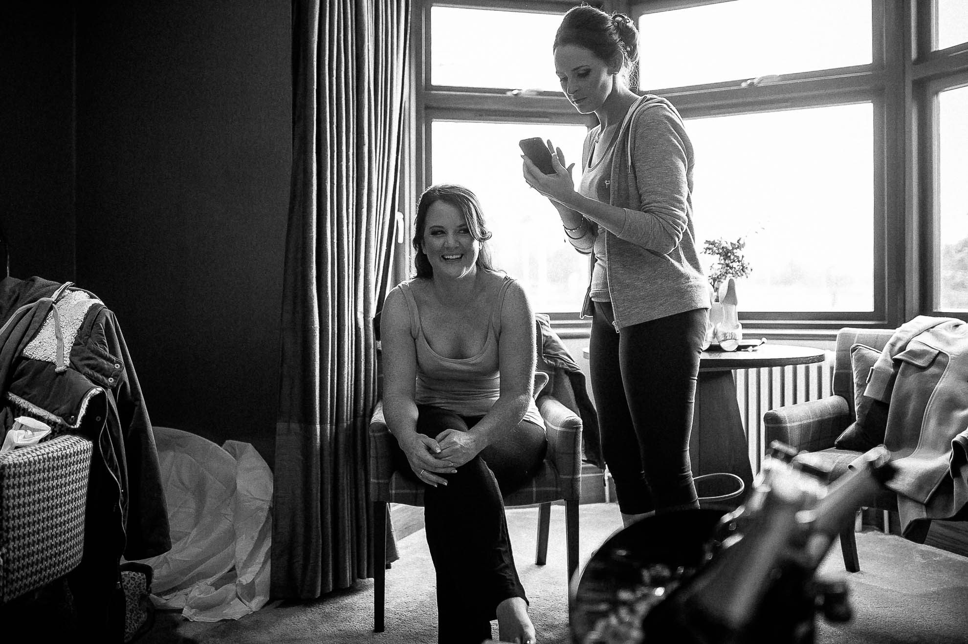 Bride shares a joke during bridal preparations
