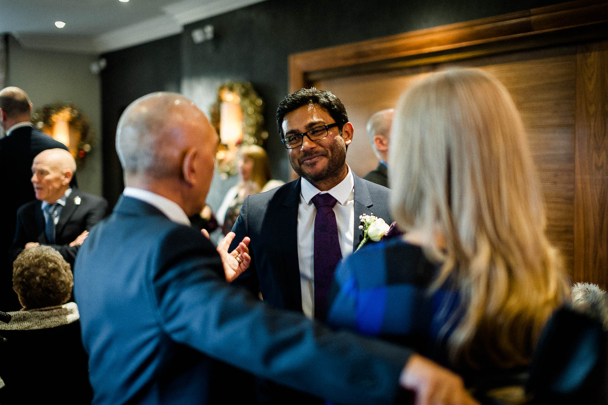 Wedding guests share a joke