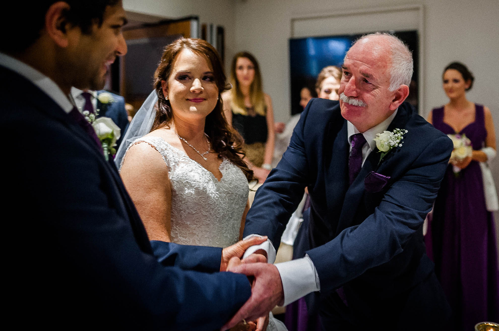Father of the bride shakes groom's hand