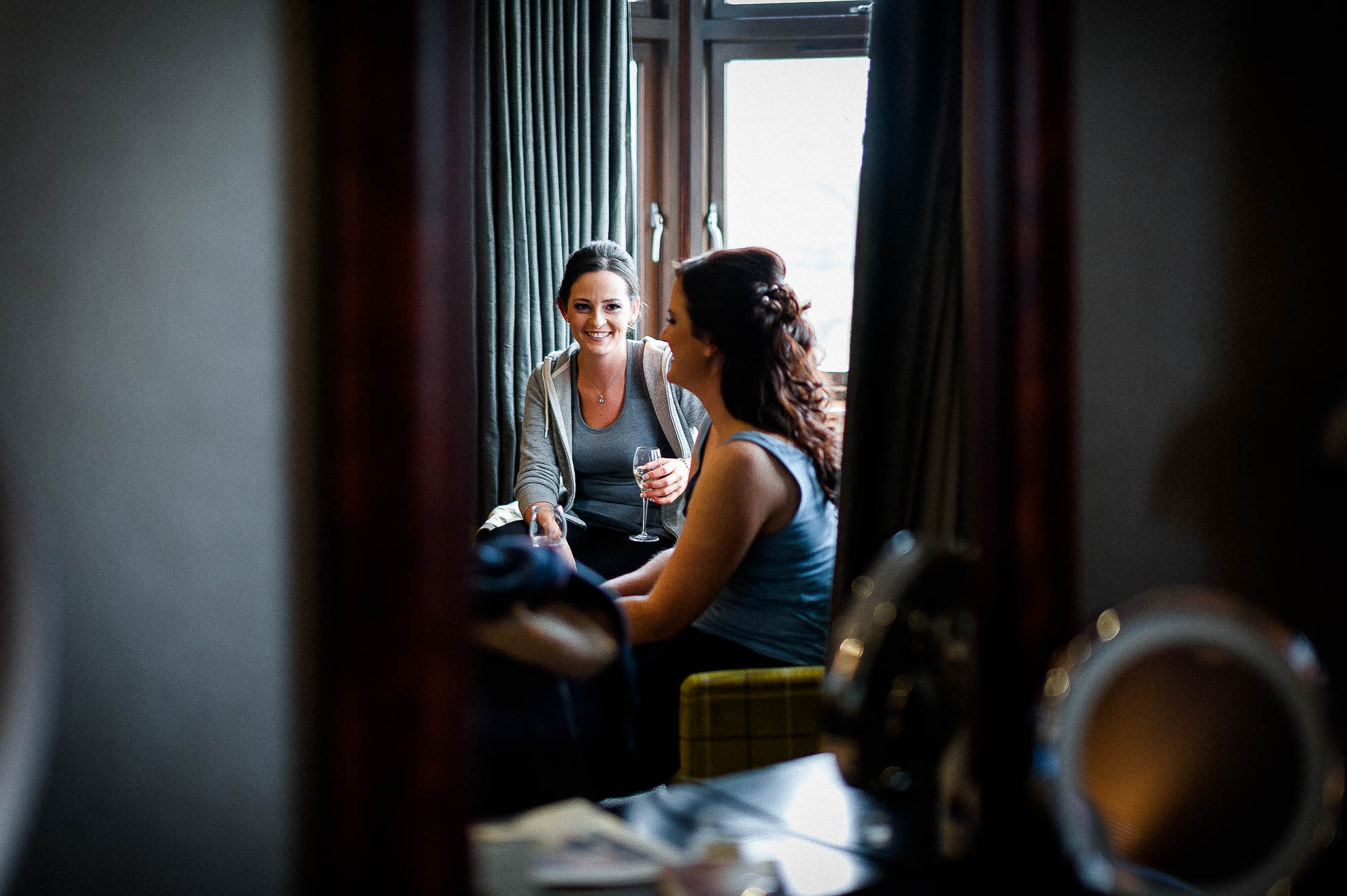 Bridesmaid and bride joking