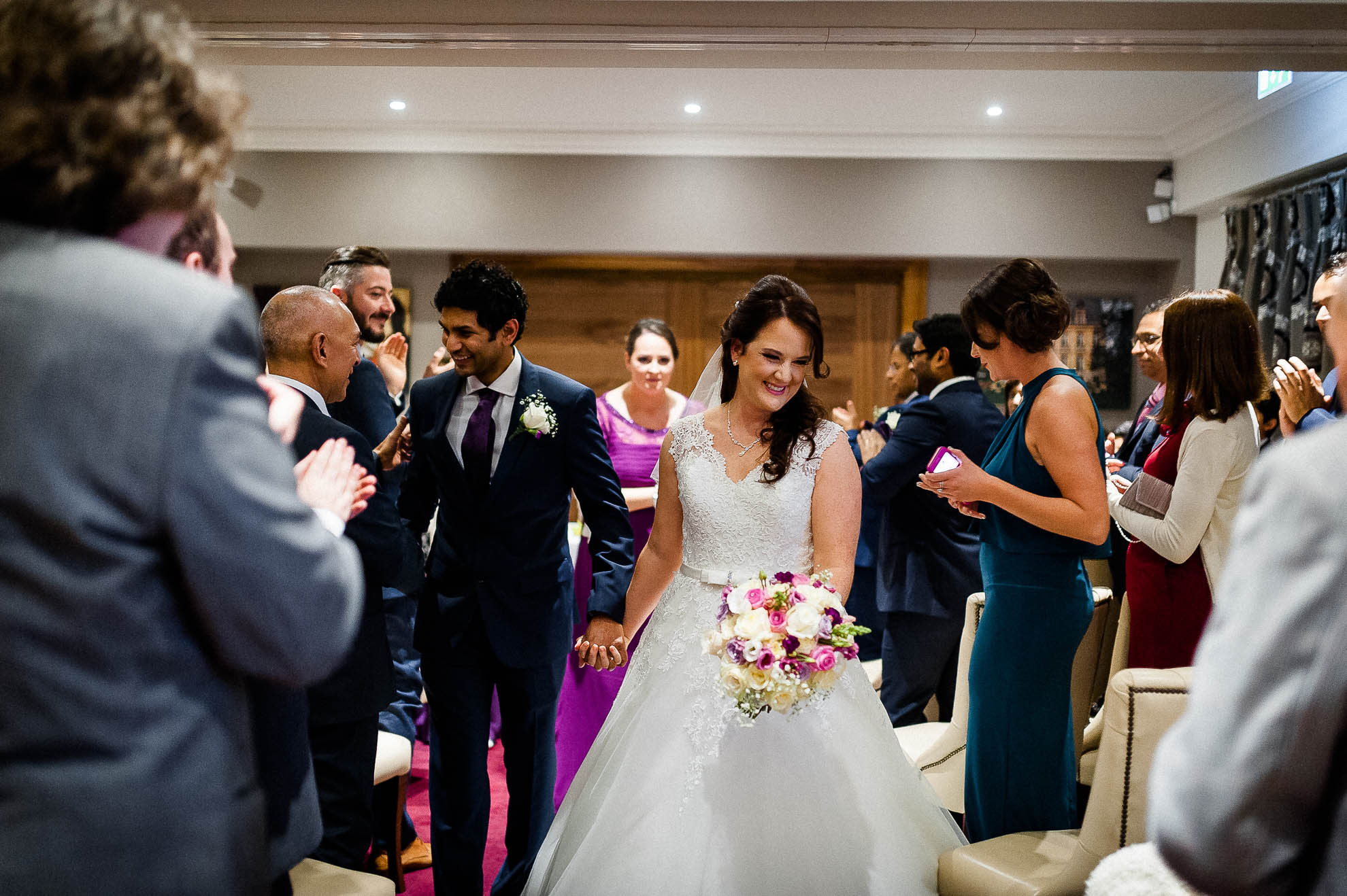 Bride and groom walk back down the aisle