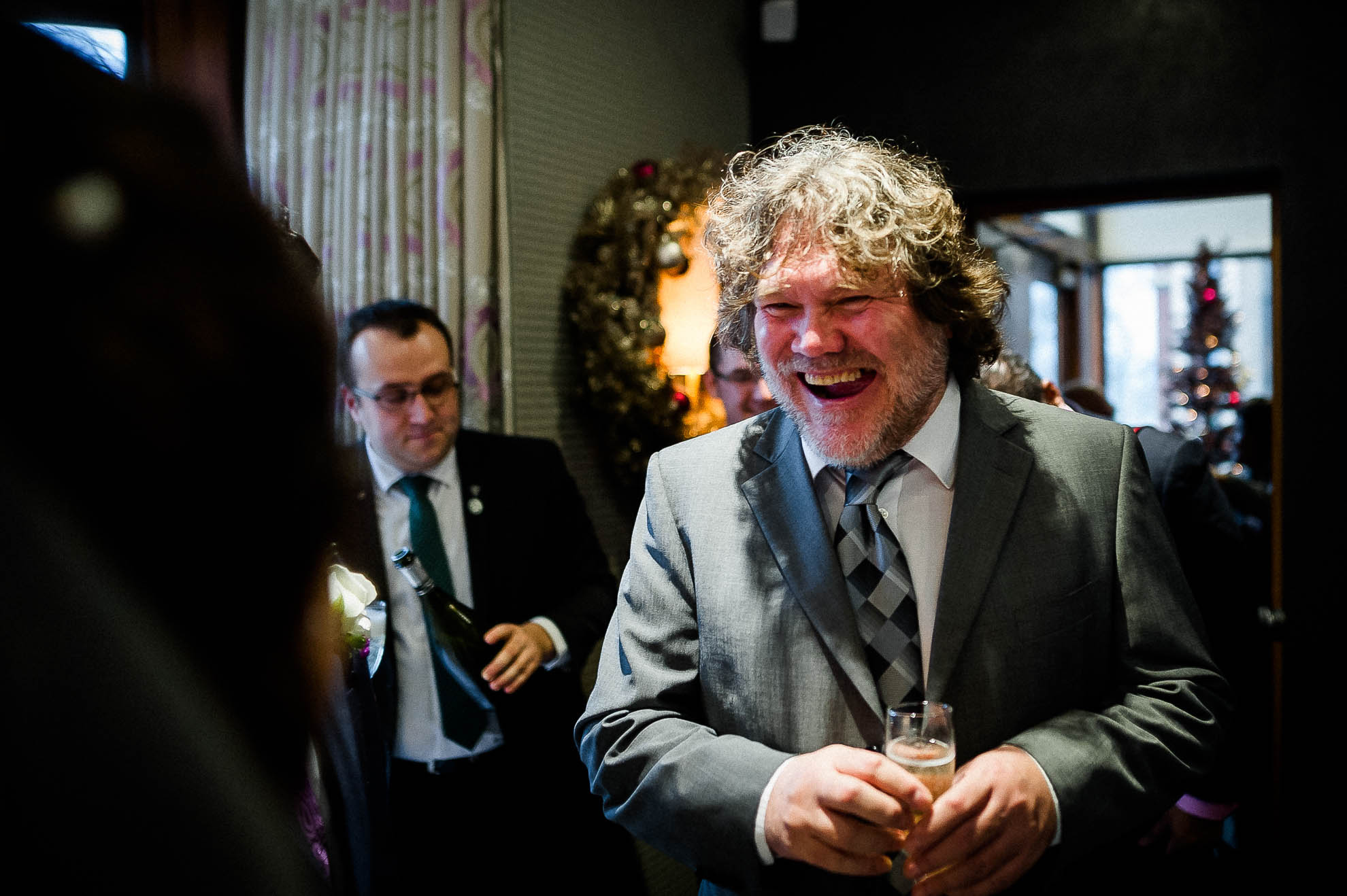 wedding guest shares a joke with the bride