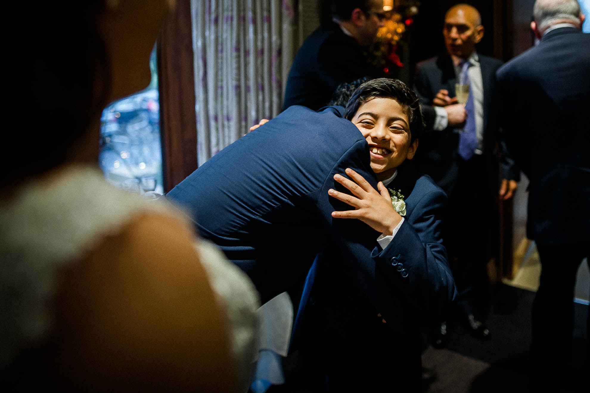 Little boy congratulates the groom