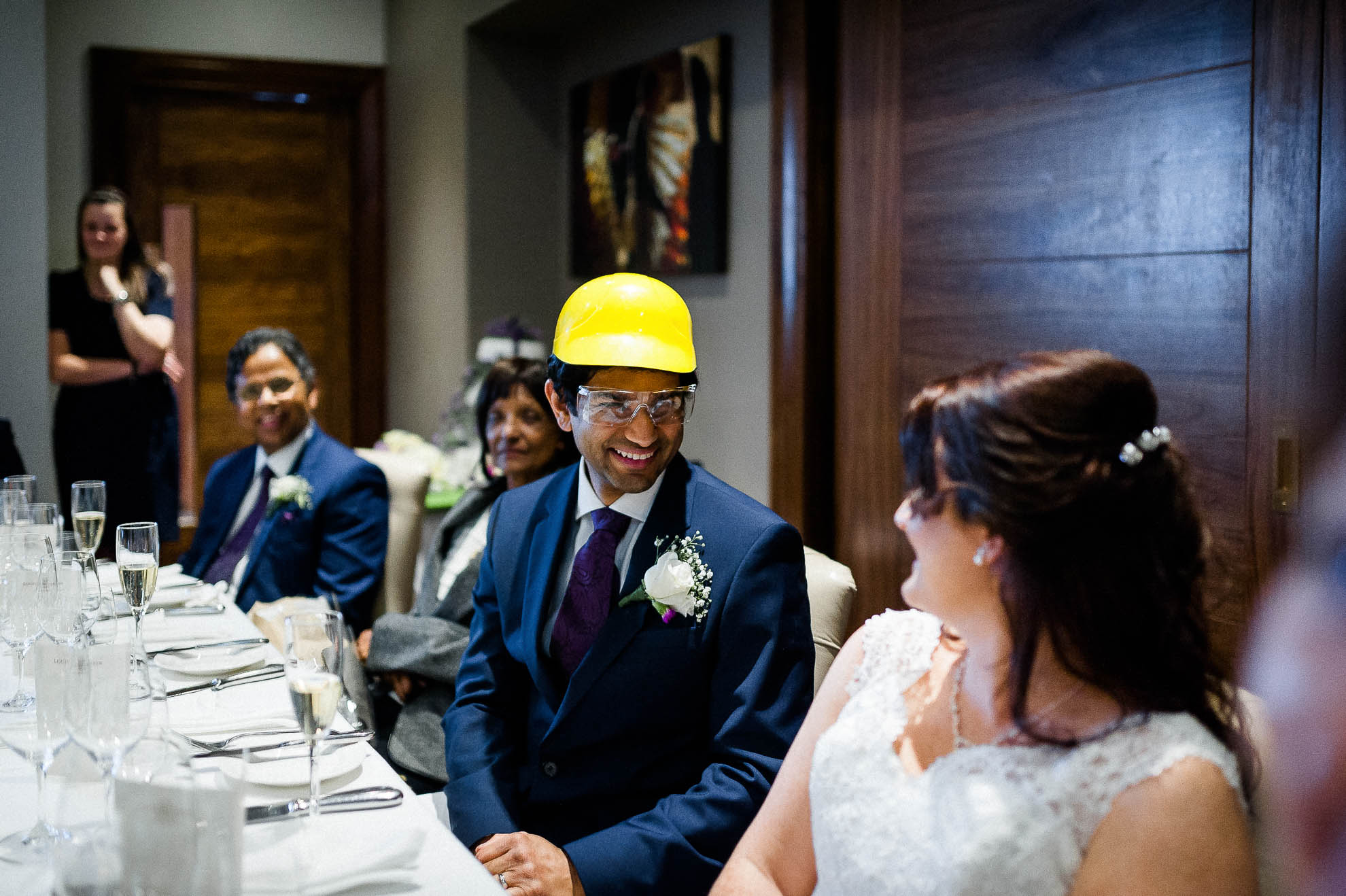 Groom wears a hard hat during speeches
