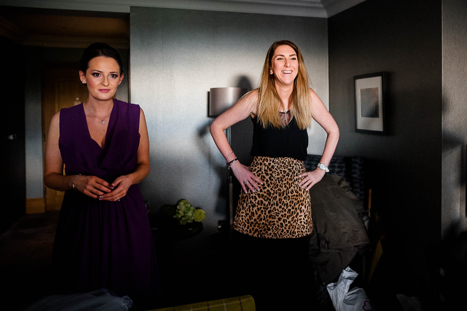 Bridesmaids react to seeing the bride in her dress