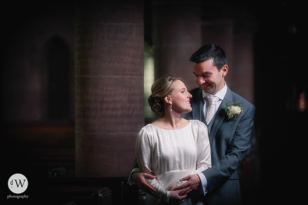 Bride and groom hold each other