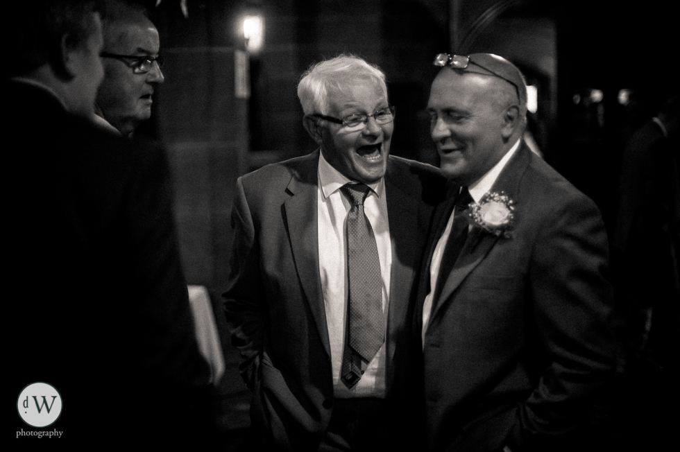 Wedding guests share a joke