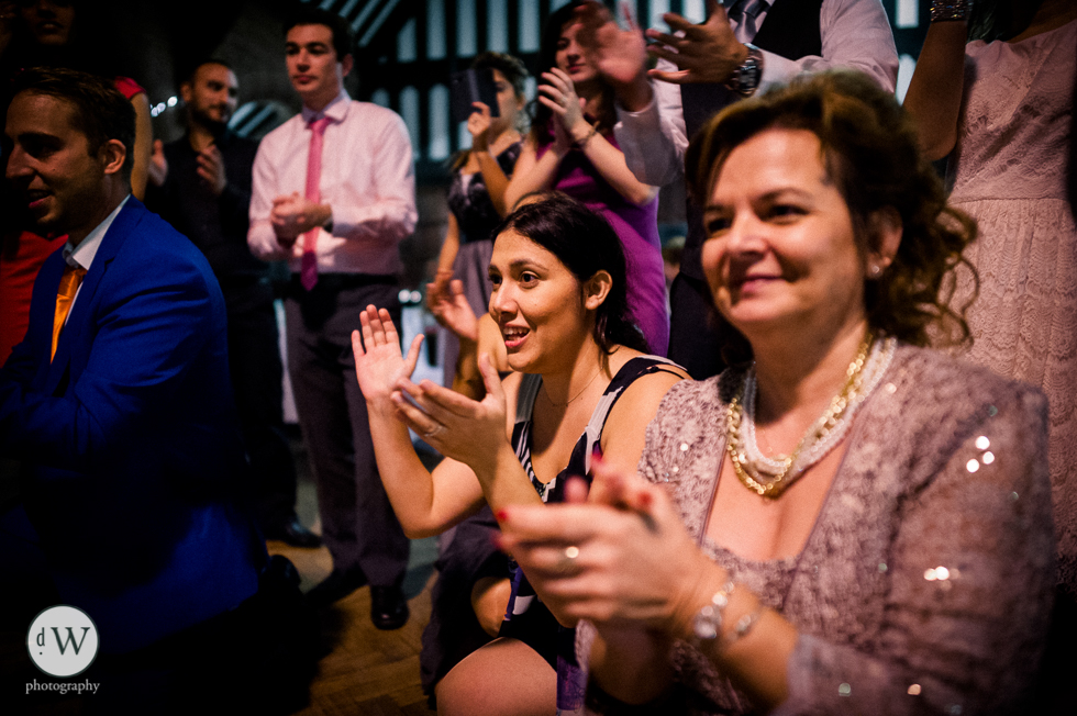 Mother of the groom watching her son dance
