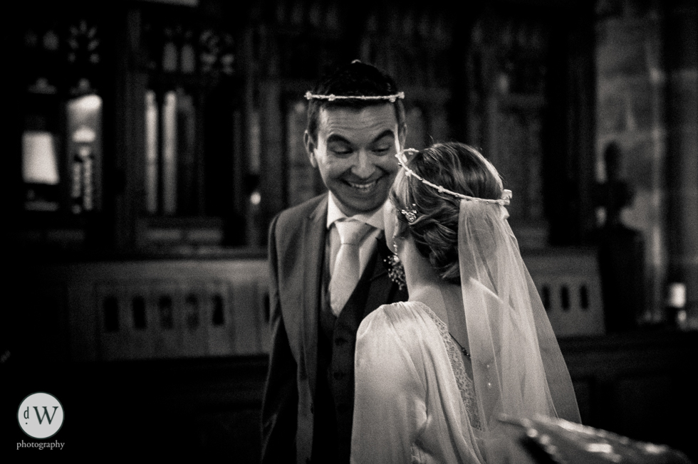 Groom smiling at the bride