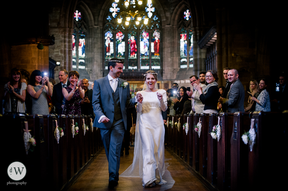 Bride and groom walk back down the aisle