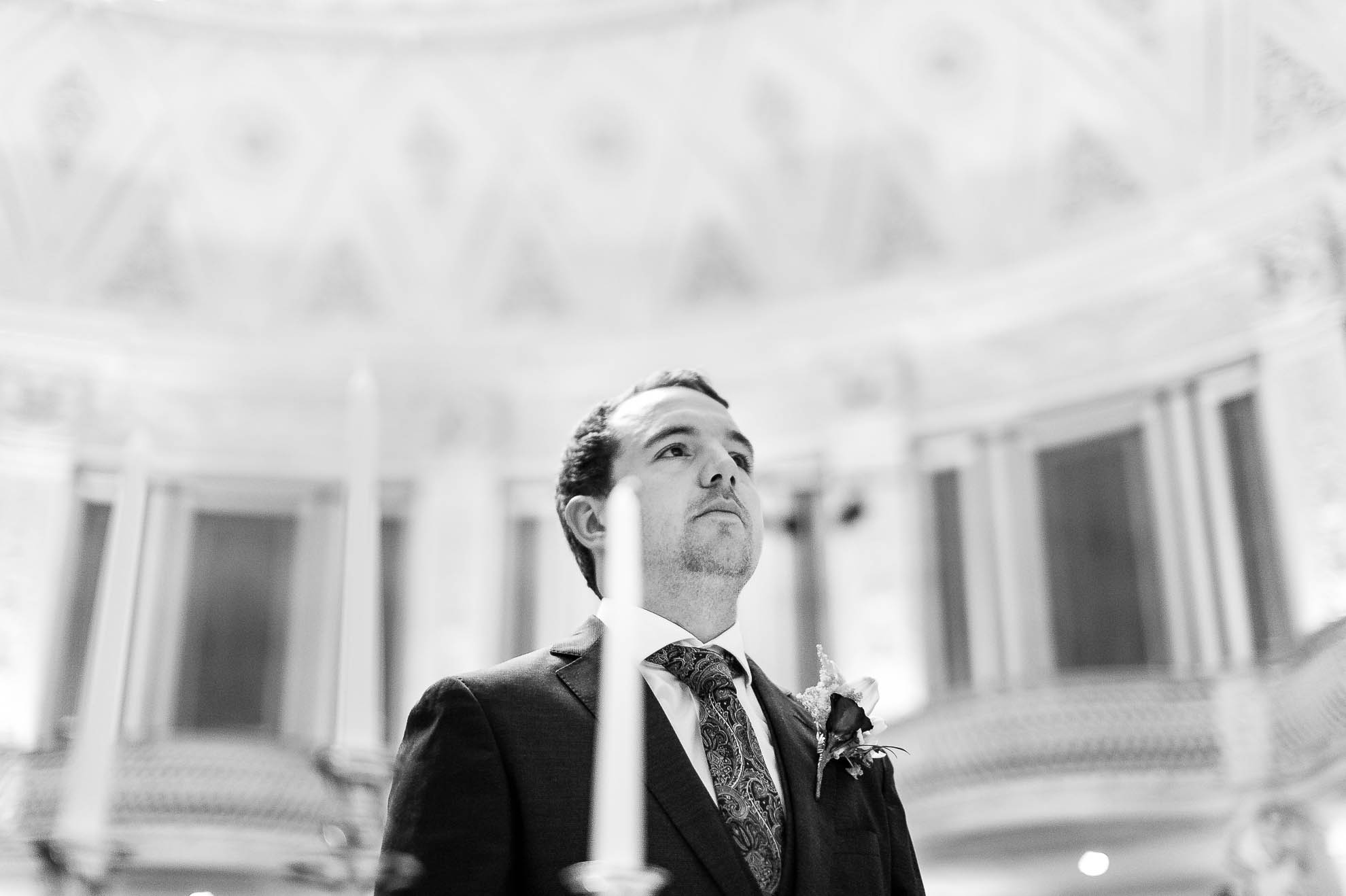 the groom waits nervously for his bride