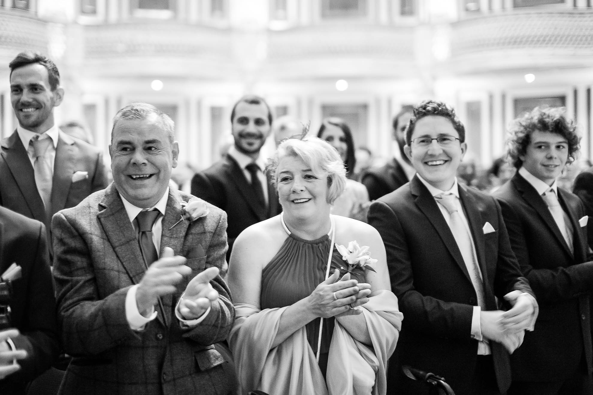 Grooms parents are delighted to see the bride