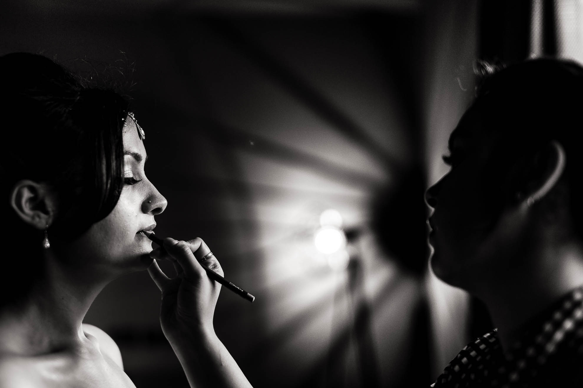 Bride having lipstick applied