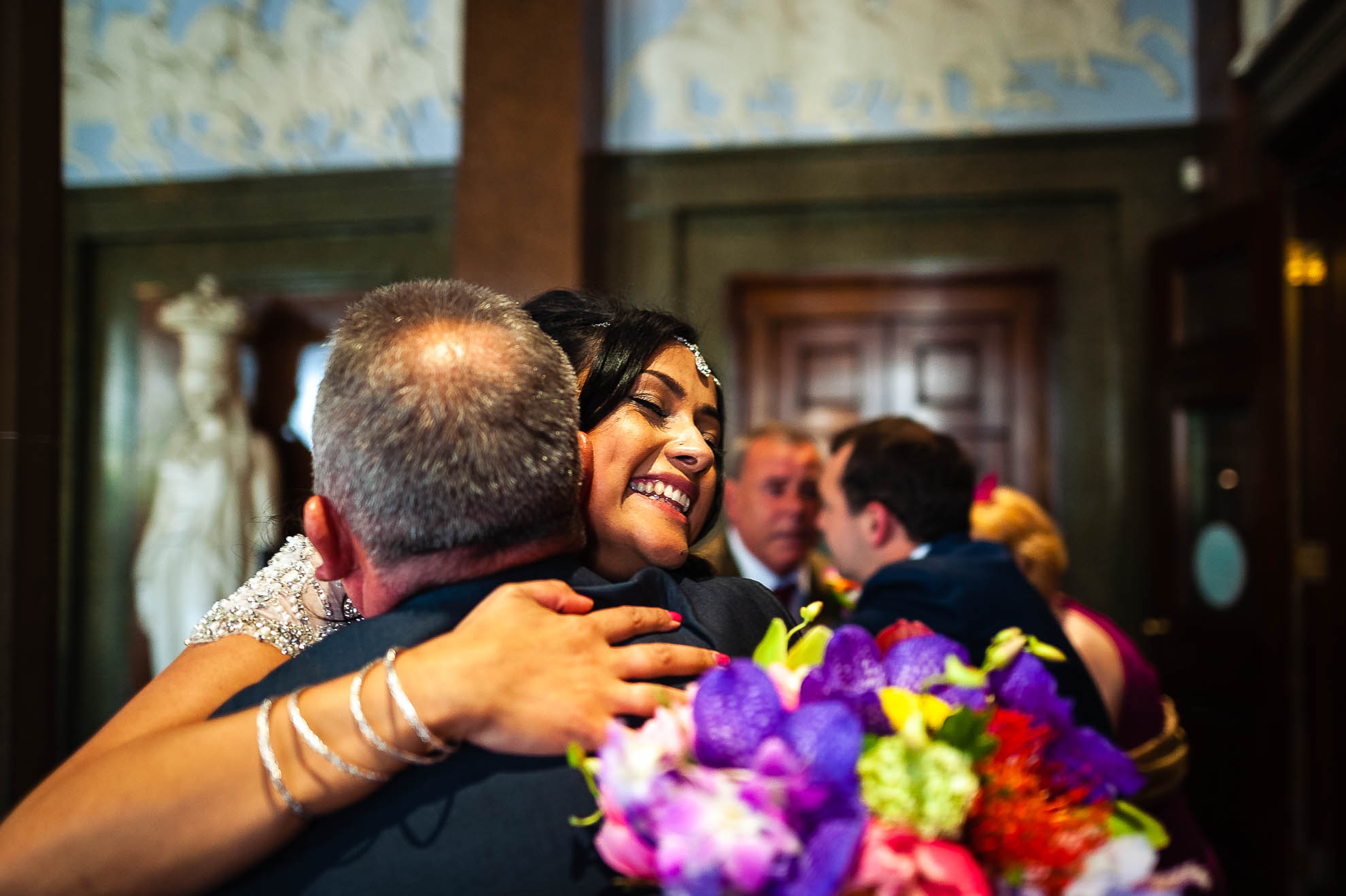bride hugs a guest