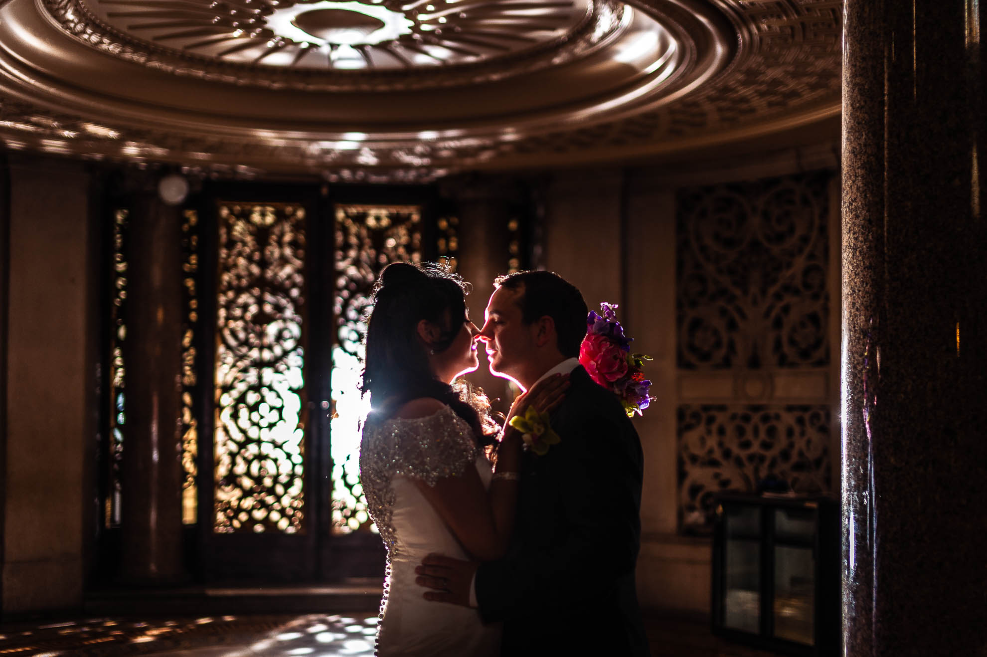 Bride and groom portrait under organ