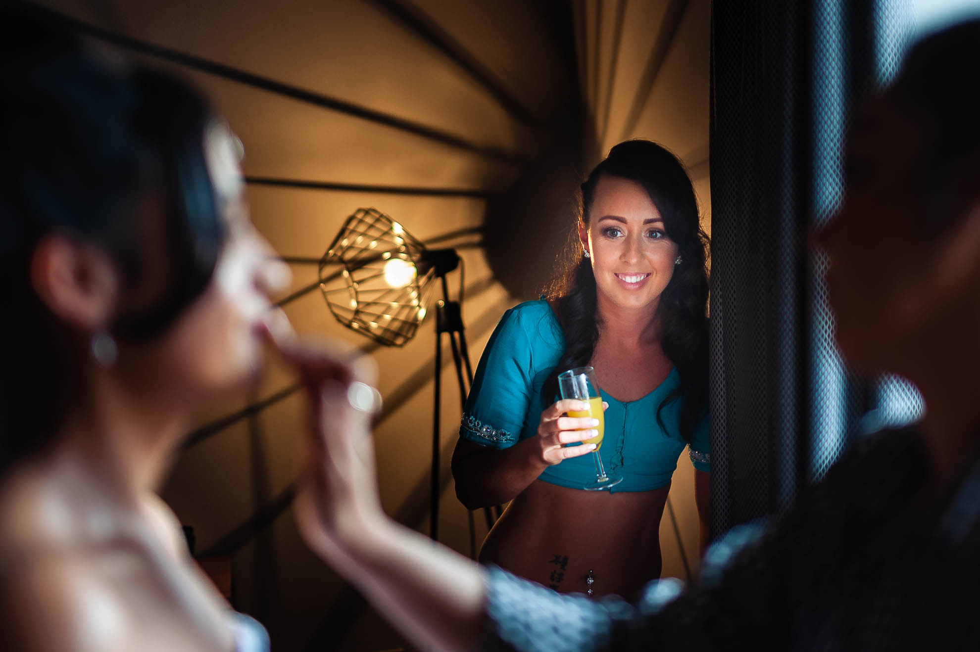 bridesmaid smiles at bride