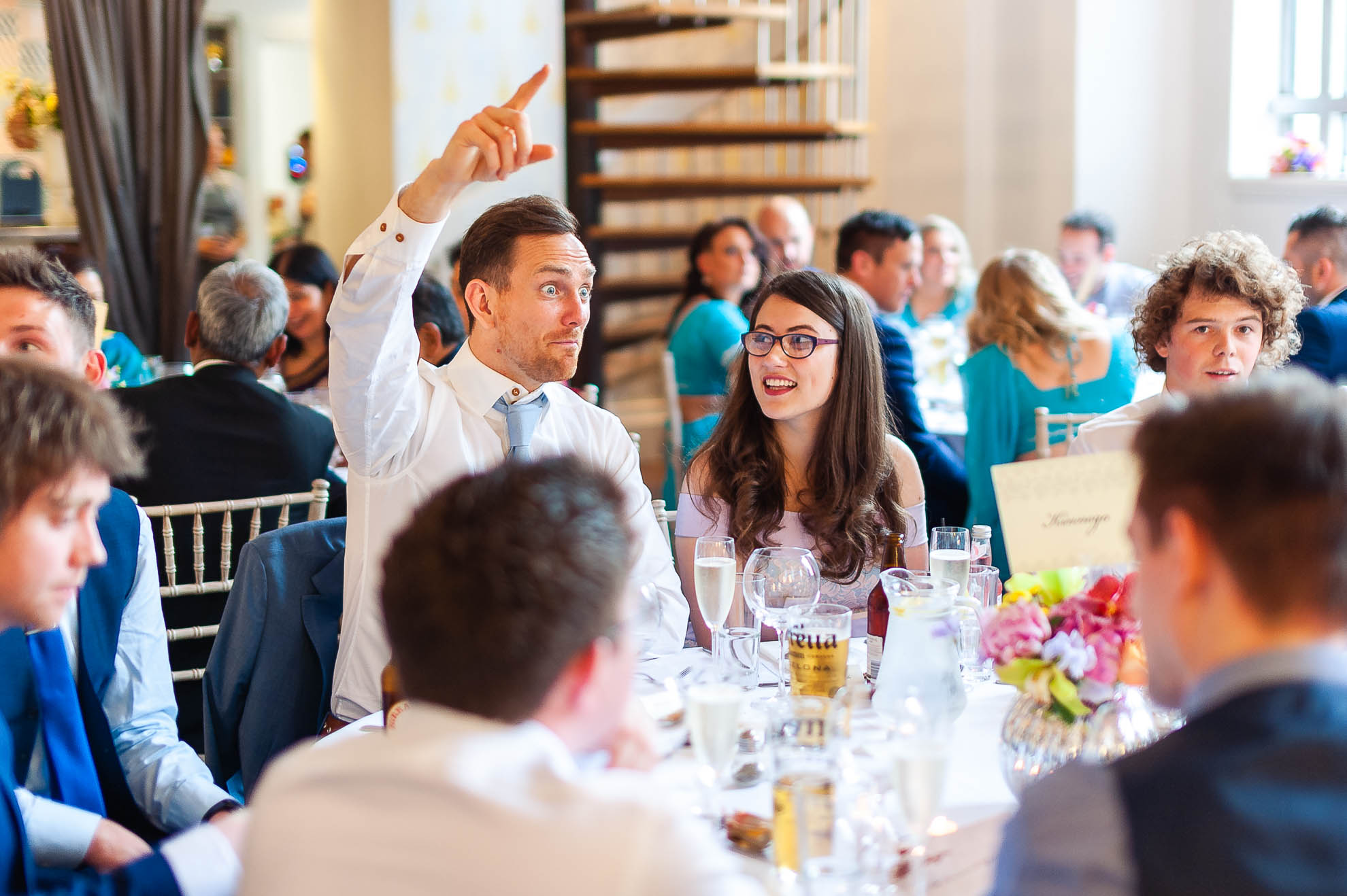 Wedding guests share a joke 