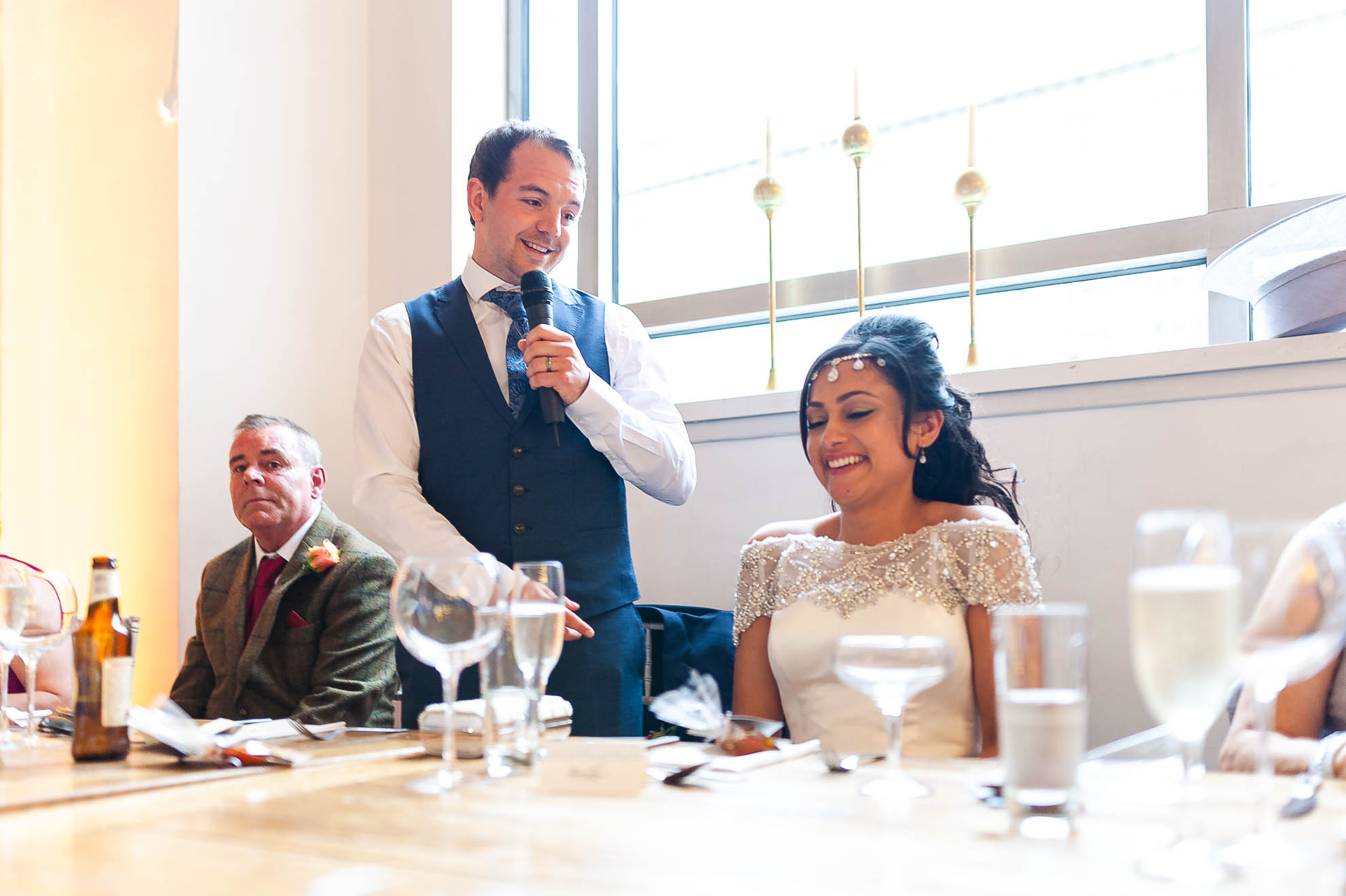 bride laughs at Grooms speech