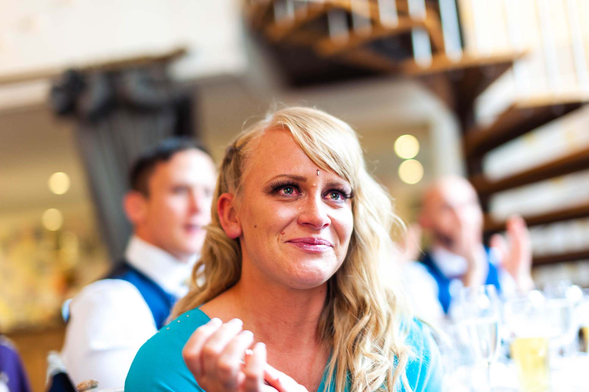 Bridesmaid sheds a tear during grooms speech